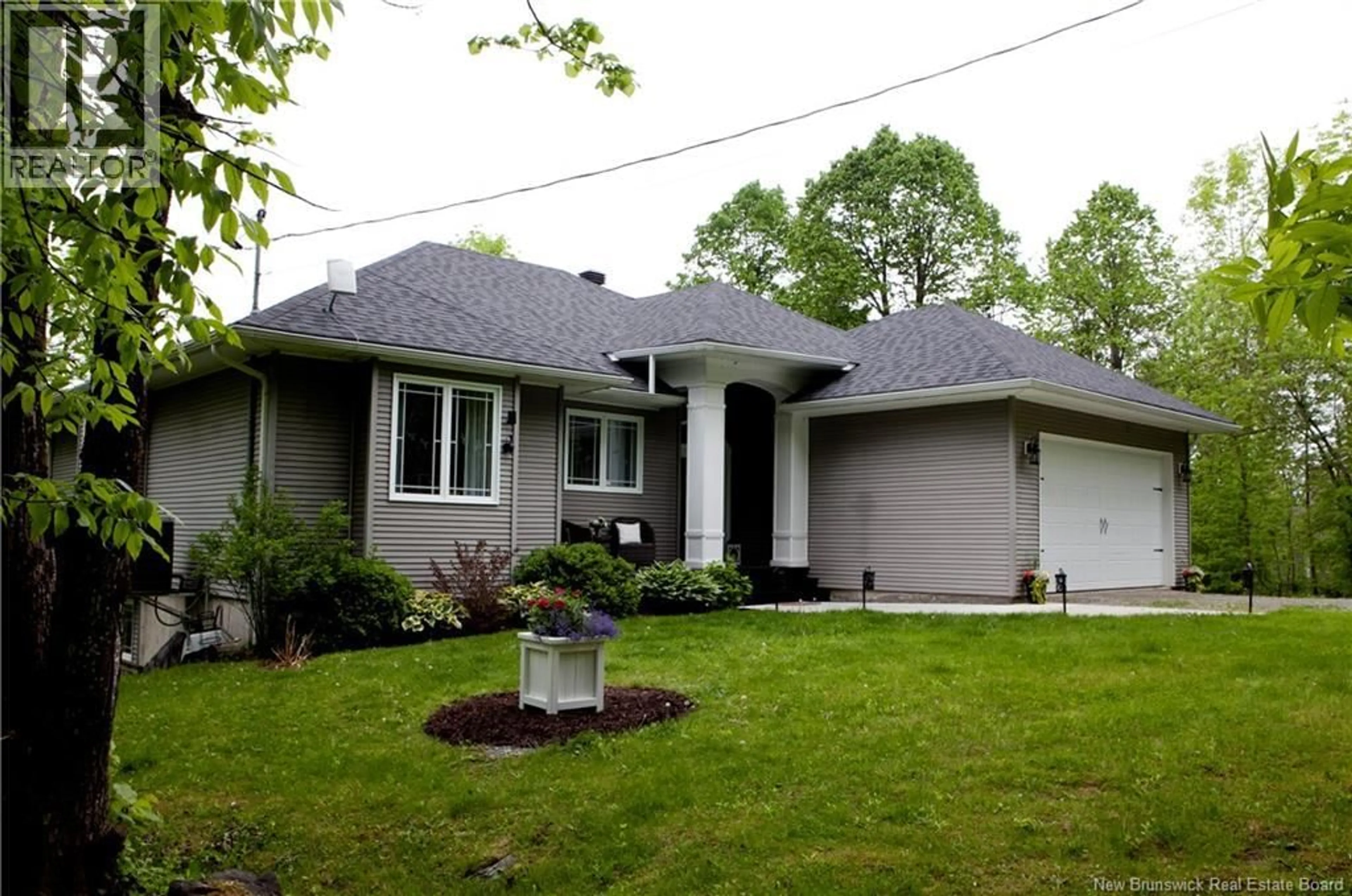 Home with vinyl exterior material, street for 5189 105 ROUTE, Grafton New Brunswick E7N1S3