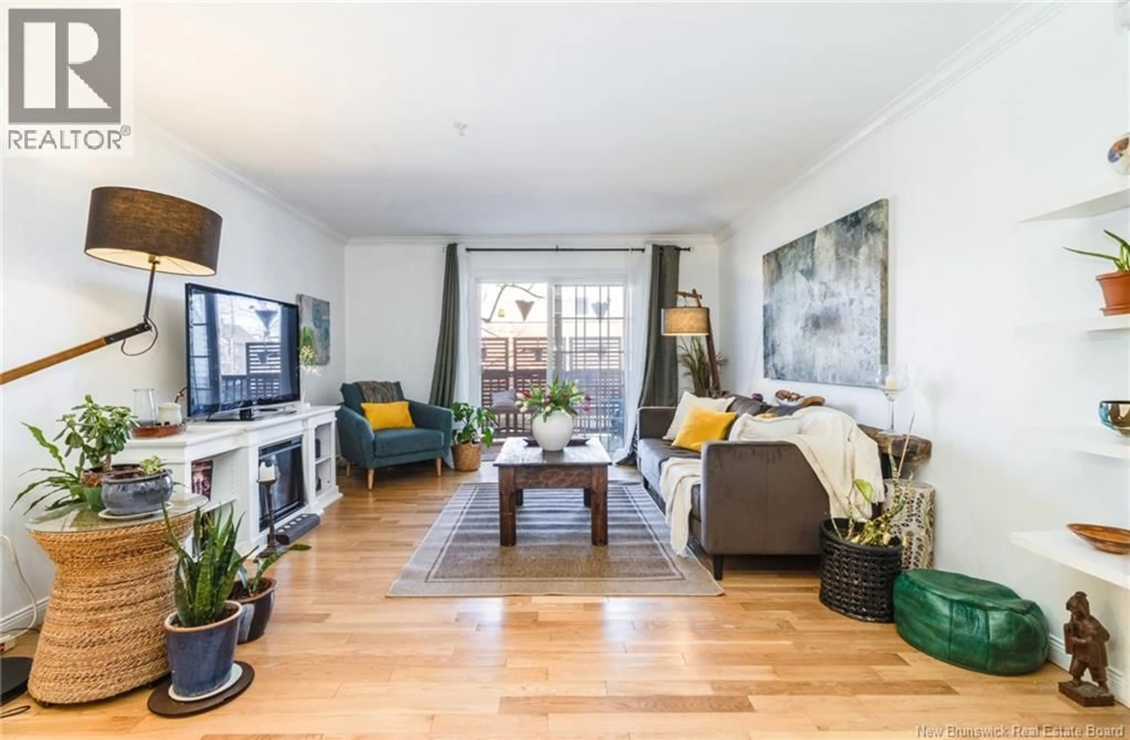 Living room with furniture, wood/laminate floor for 110 - 362 CARLETON STREET, Fredericton New Brunswick E3B0C8