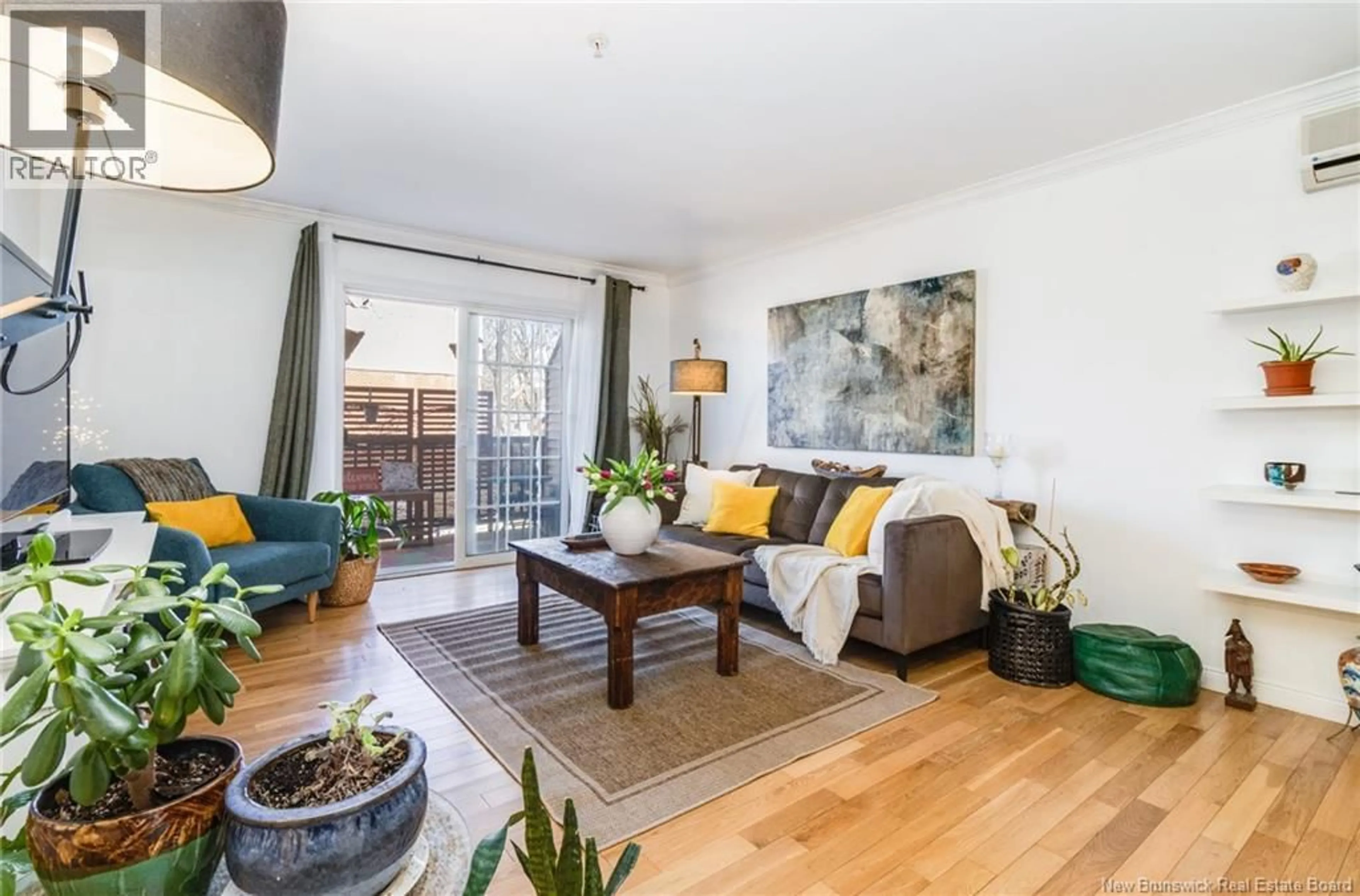 Living room with furniture, wood/laminate floor for 110 - 362 CARLETON STREET, Fredericton New Brunswick E3B0C8