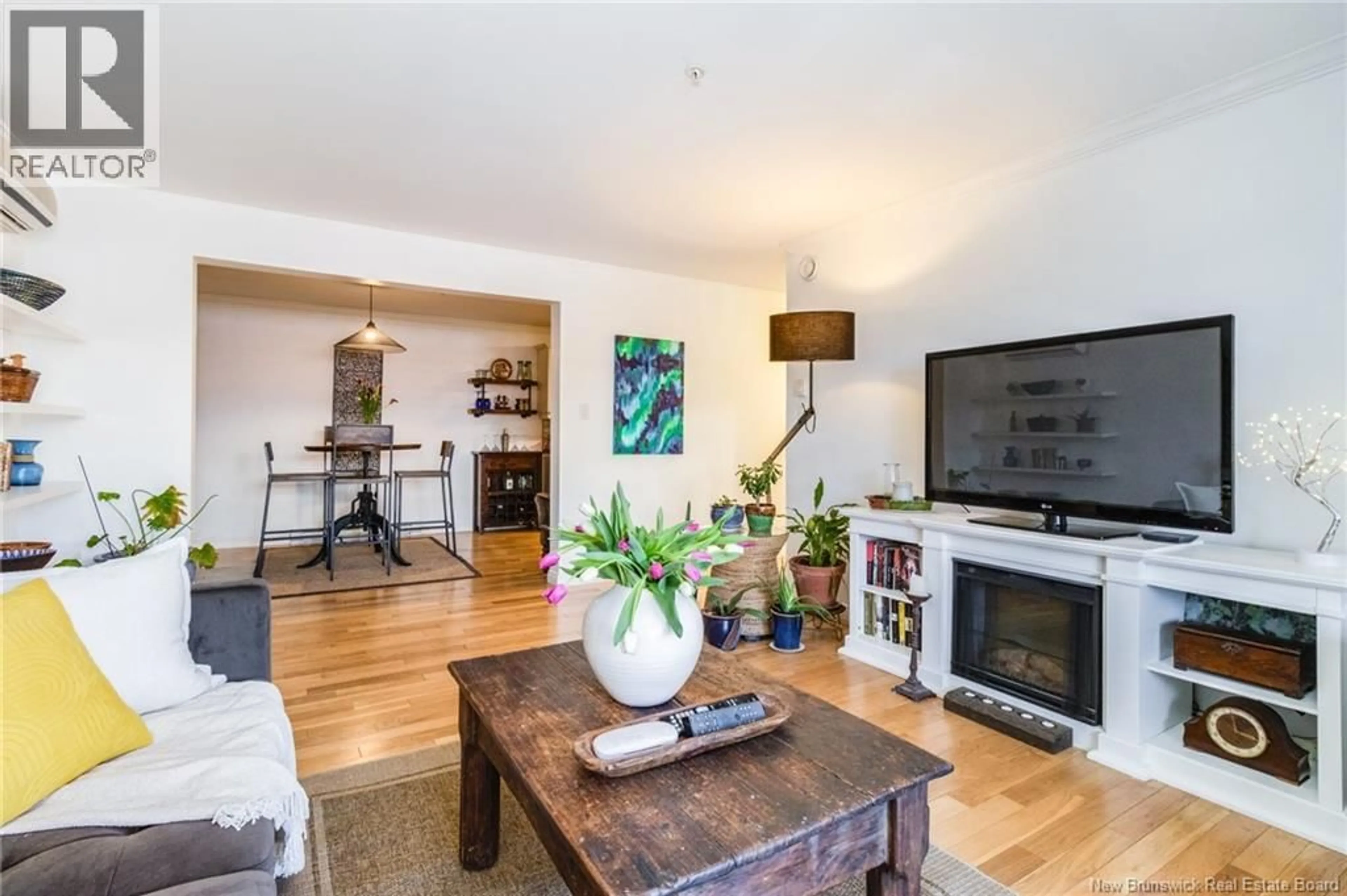 Living room with furniture, wood/laminate floor for 110 - 362 CARLETON STREET, Fredericton New Brunswick E3B0C8
