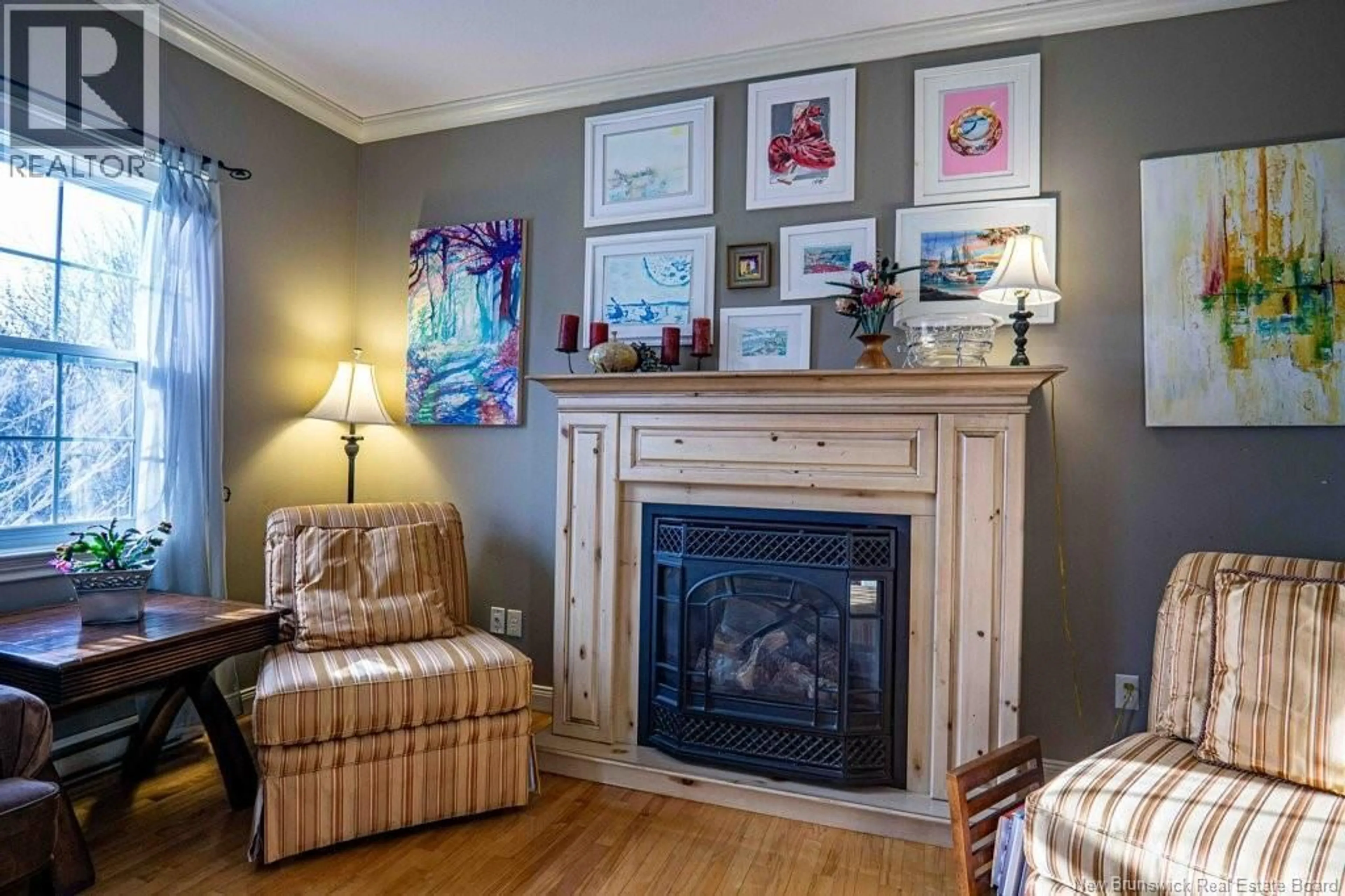 Living room with furniture, wood/laminate floor for 9 JENNIE COURT, Fredericton New Brunswick E3B9X9