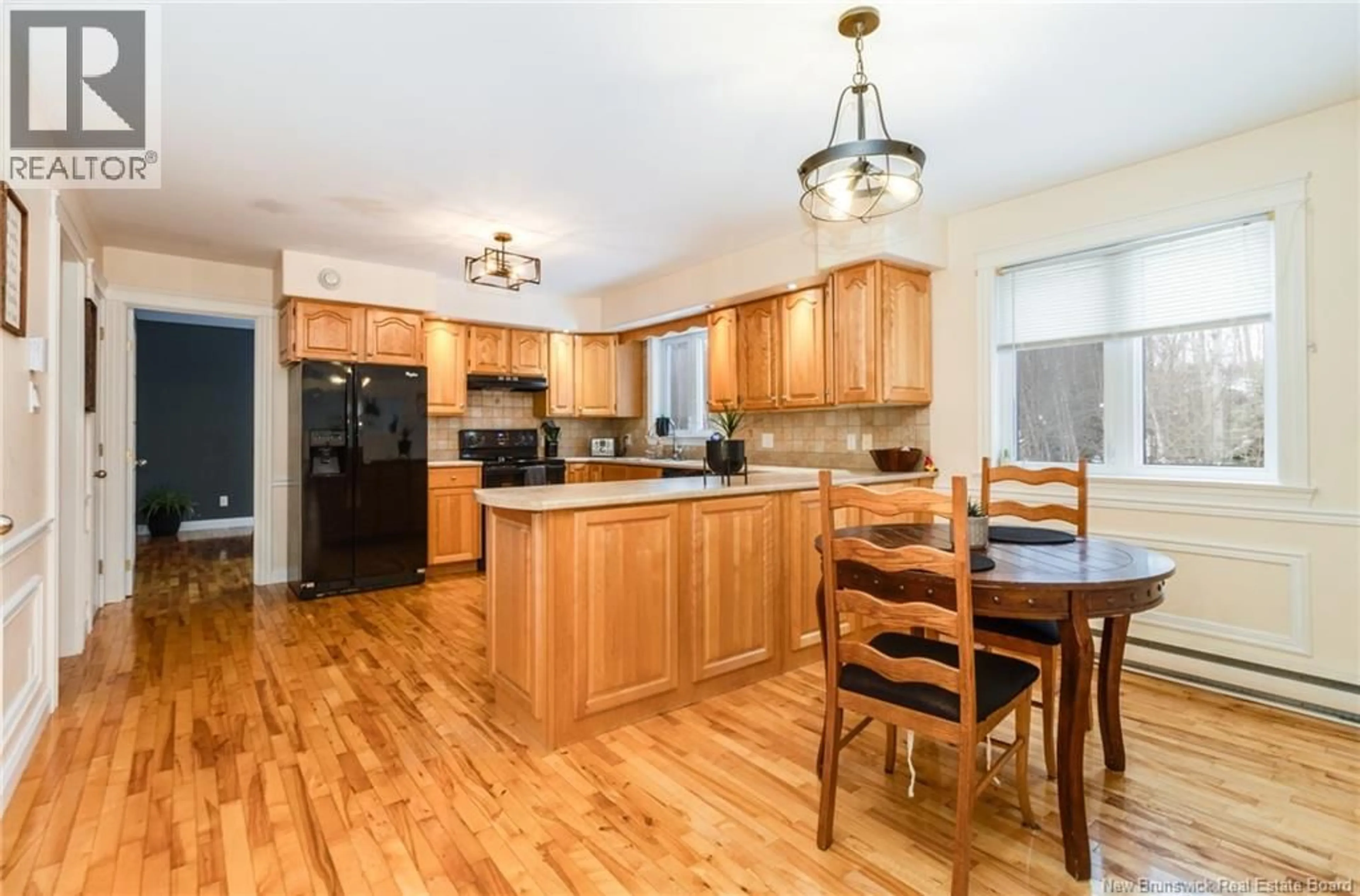 Open concept kitchen, wood/laminate floor for 21 SHALLON LANE, Pepper Creek New Brunswick E3A9R3