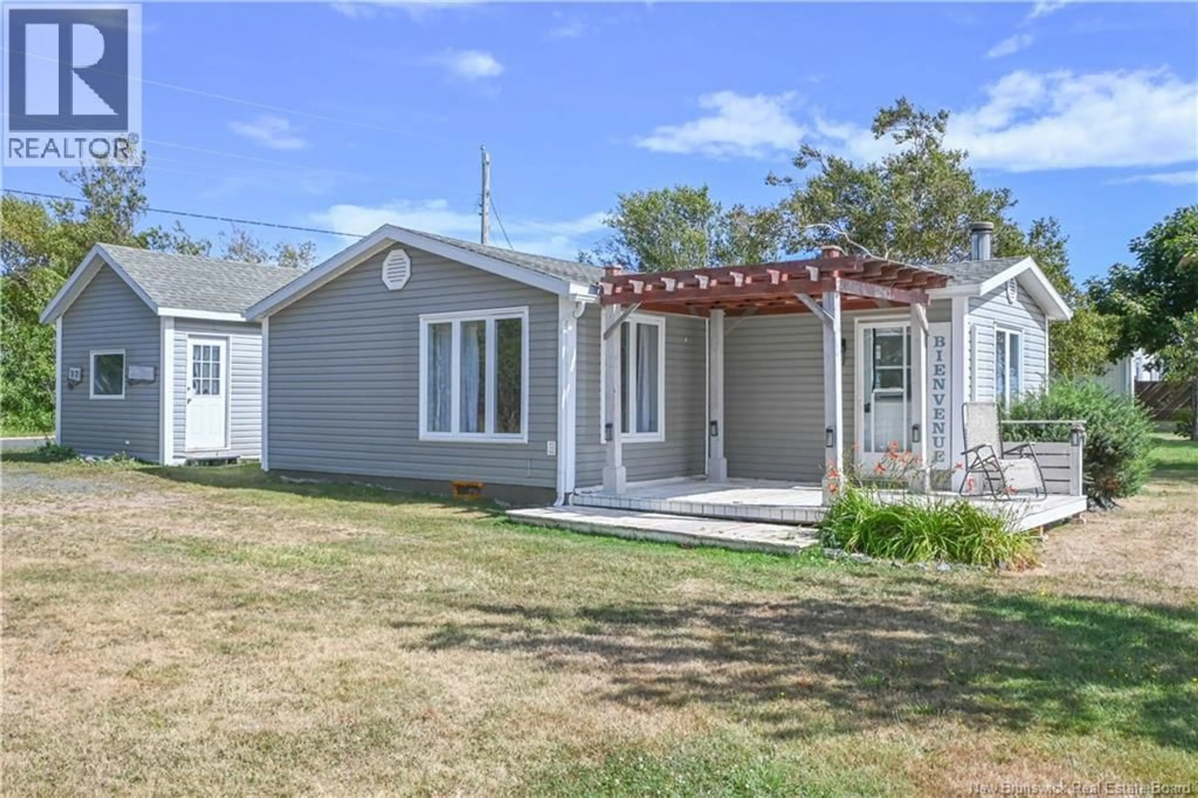 Home with vinyl exterior material, street for 22 RUE DES CHALETS, Inkerman Ferry New Brunswick E8P1V8