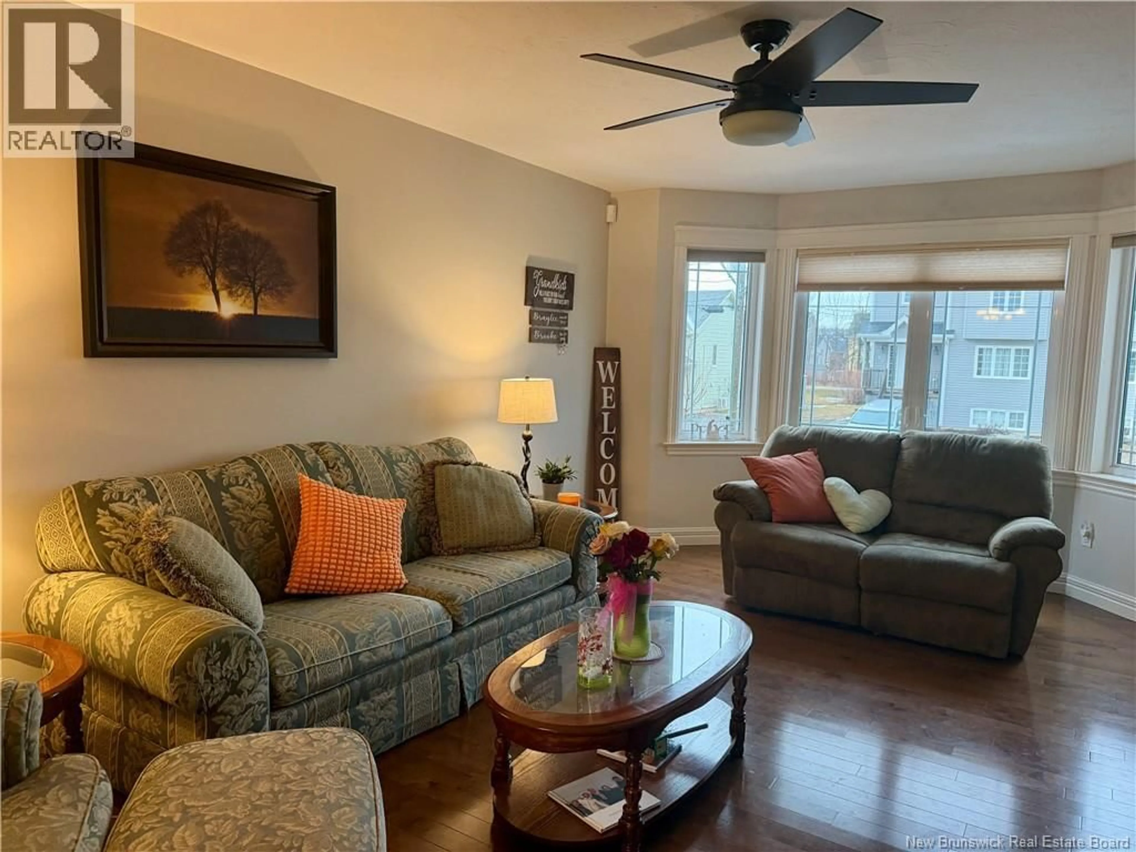 Living room with furniture, wood/laminate floor for 54 CLARENDON DRIVE, Moncton New Brunswick E1G0M9