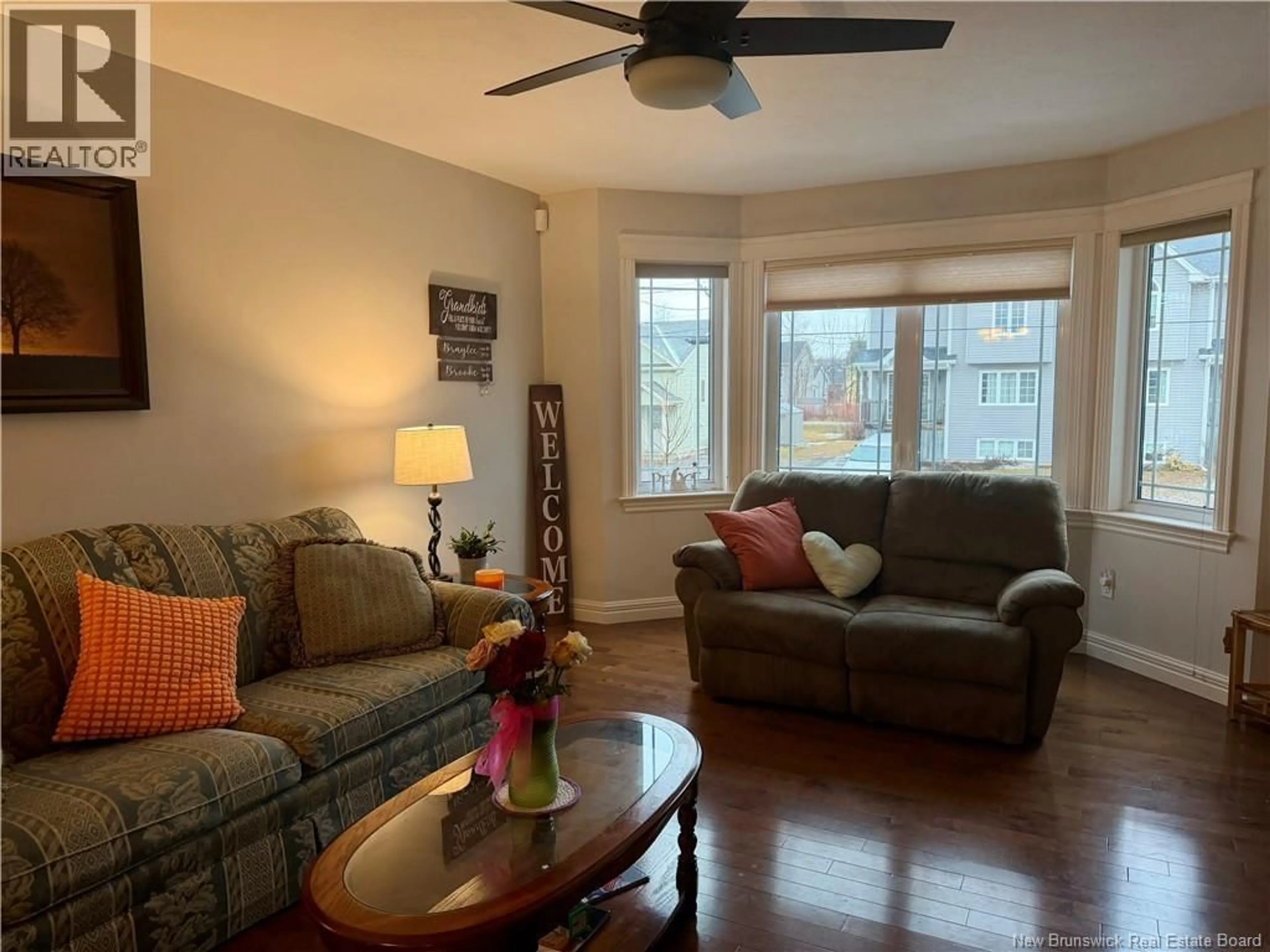 Living room with furniture, wood/laminate floor for 54 CLARENDON DRIVE, Moncton New Brunswick E1G0M9