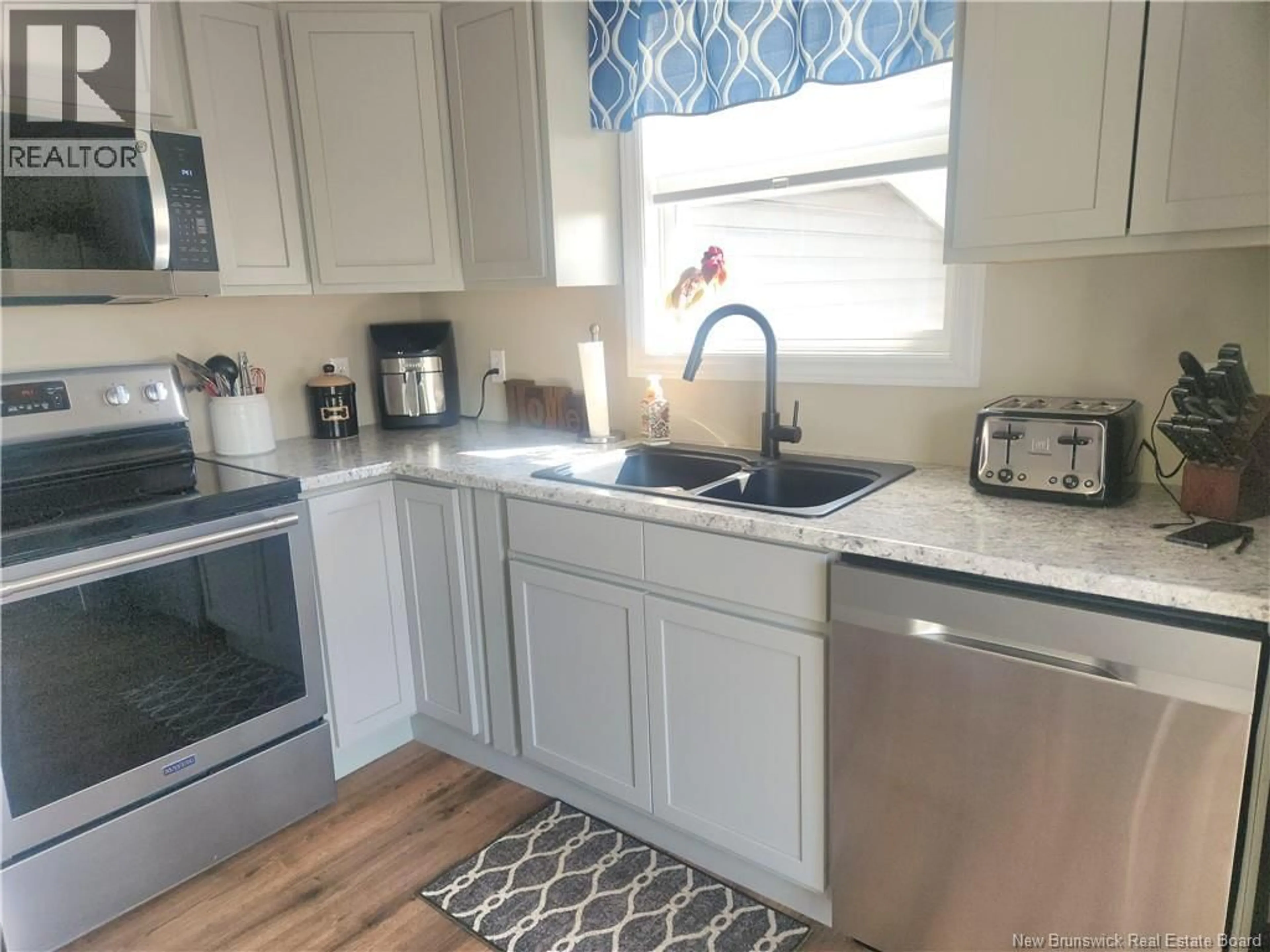 Open concept kitchen, ceramic/tile floor for 57 MCCLAUSKEY TERRACE, Grand-Sault/Grand Falls New Brunswick E3Y1E1
