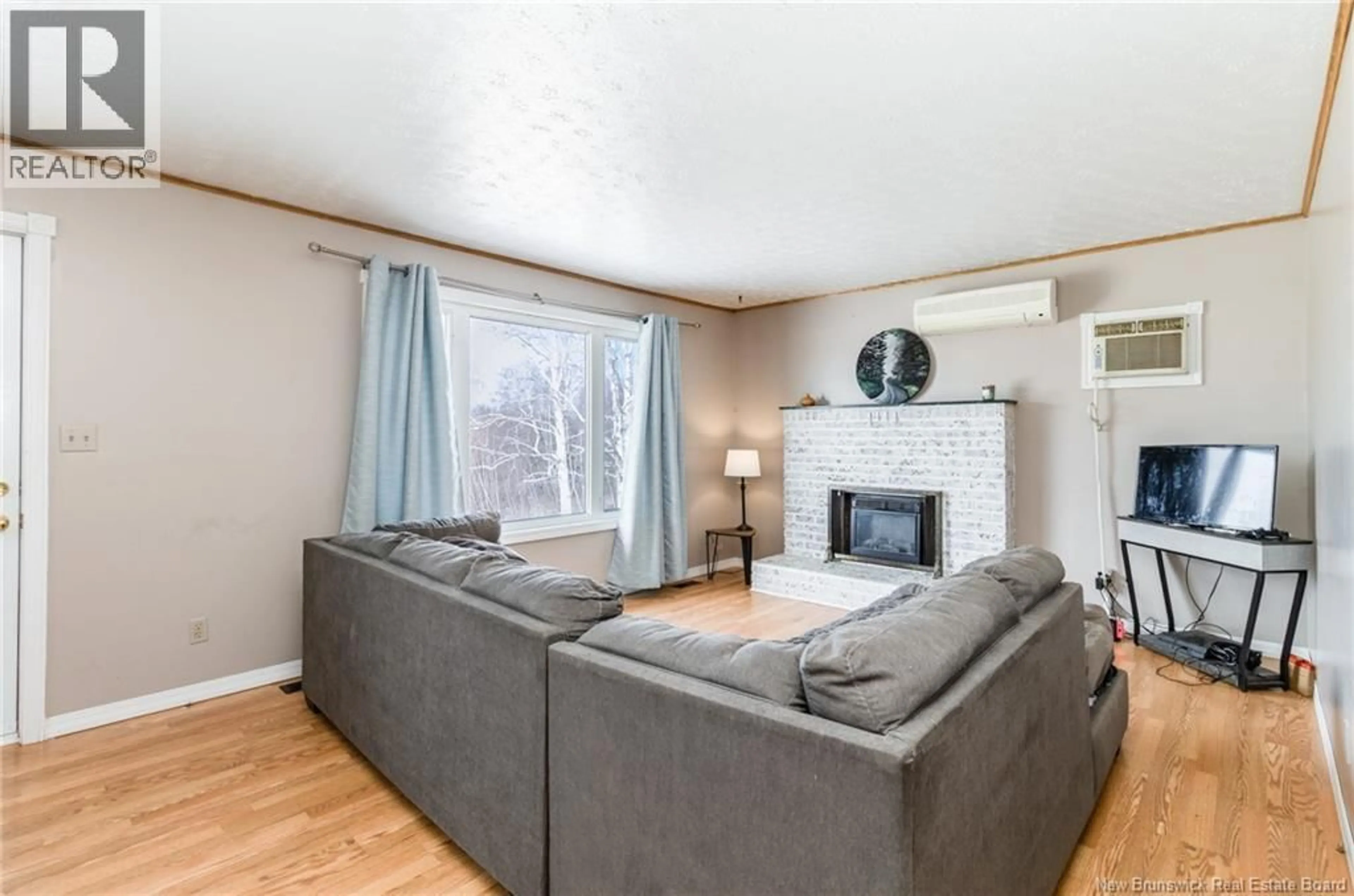 Living room with furniture, wood/laminate floor for 5 HOLMES ROAD, Grand Lake New Brunswick E4B1H8