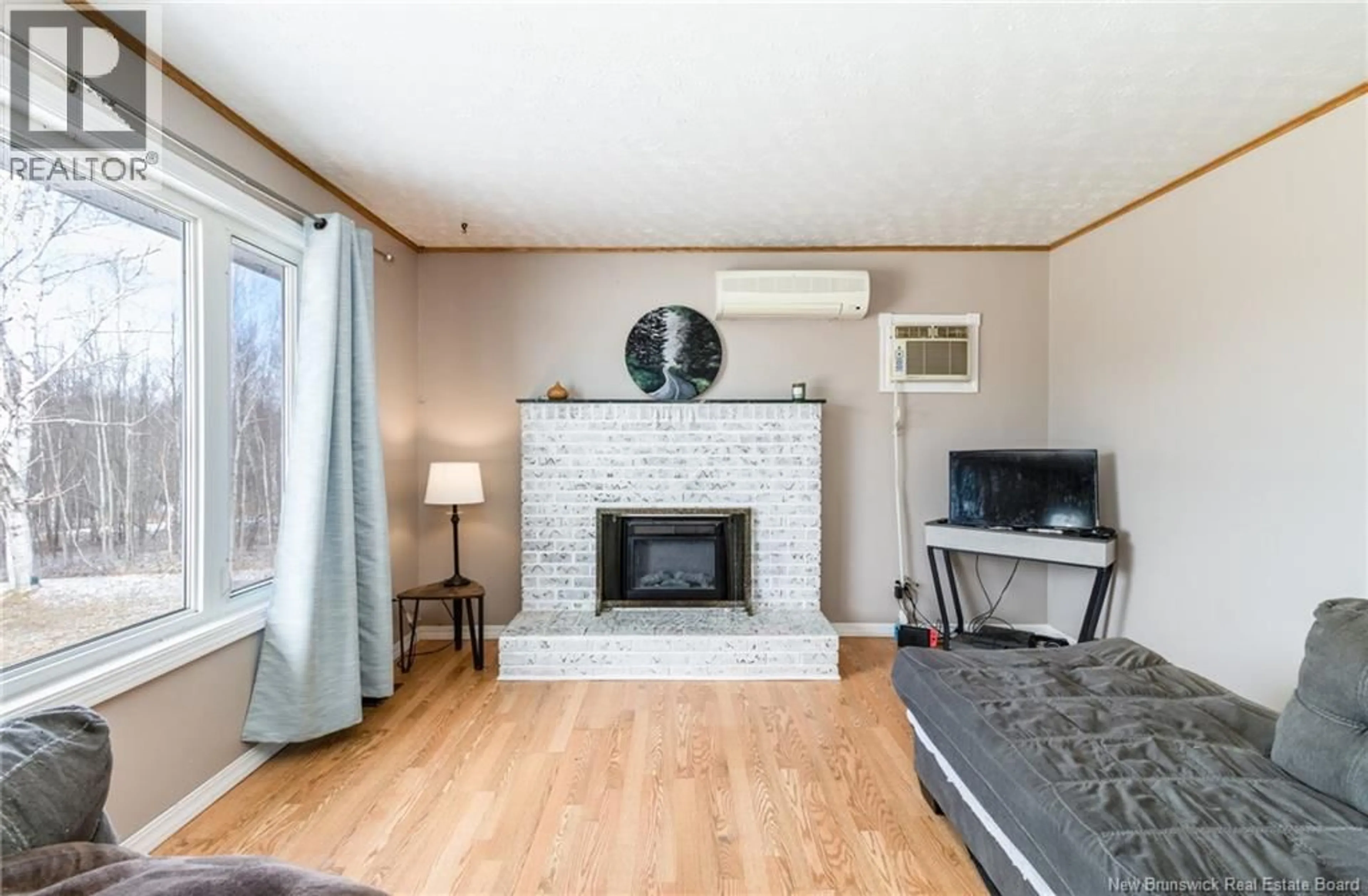 Living room with furniture, wood/laminate floor for 5 HOLMES ROAD, Grand Lake New Brunswick E4B1H8