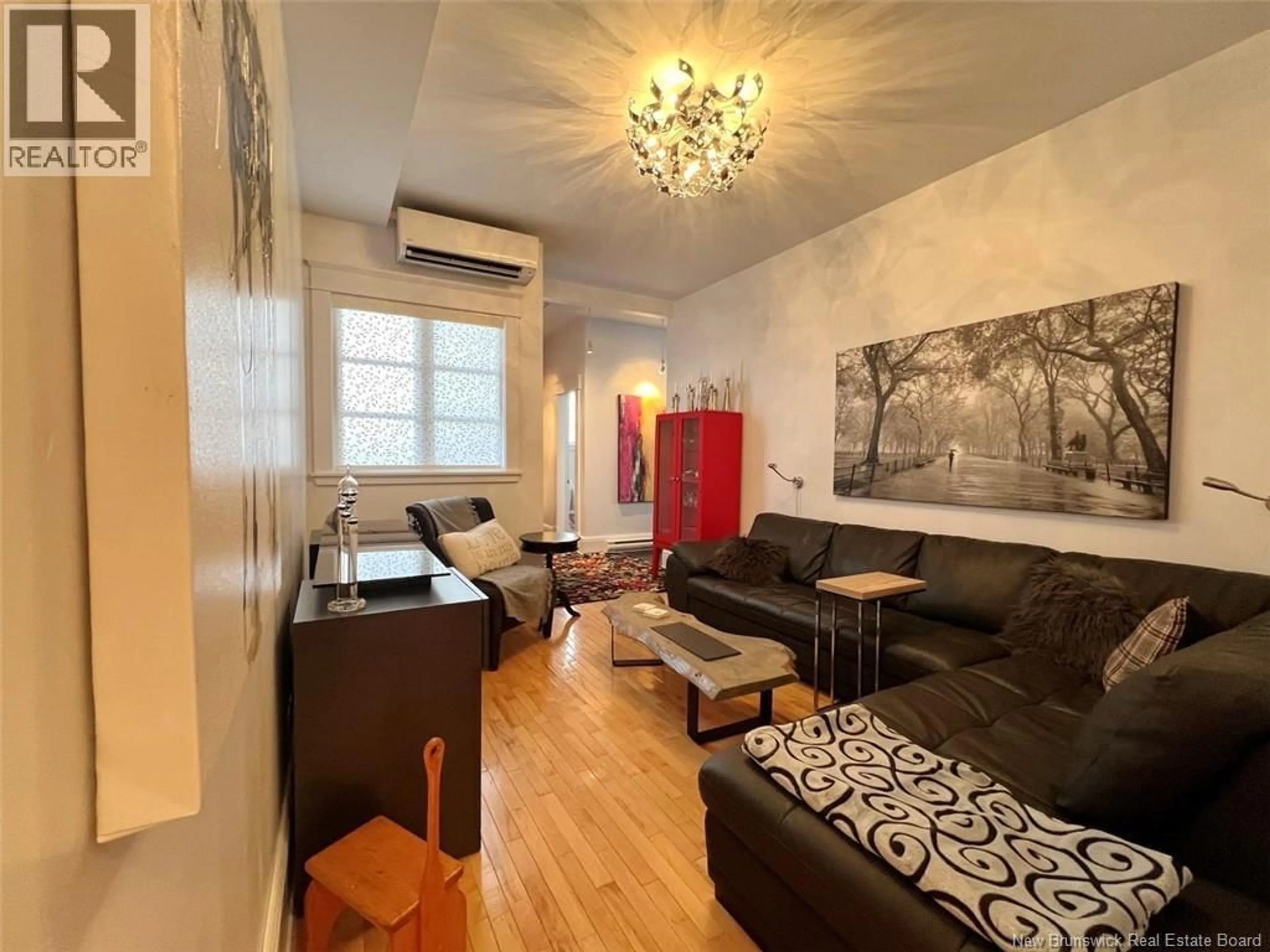 Living room with furniture, wood/laminate floor for 87 DE L'ÉGLISE STREET, Edmundston New Brunswick E3V1J6
