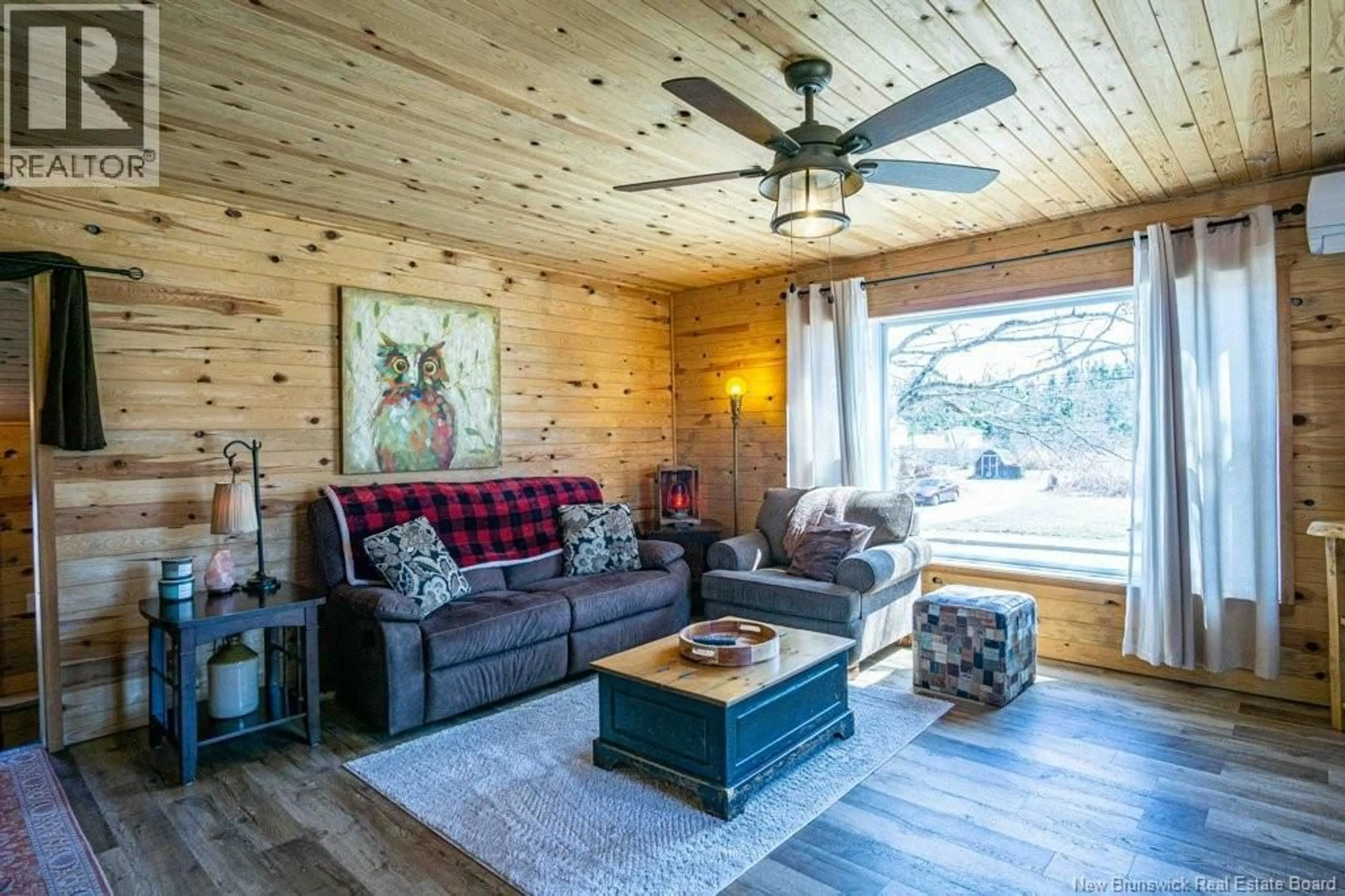 Living room with furniture, wood/laminate floor for 94 WALLACE COVE ROAD, Blacks Harbour New Brunswick E5H1H1