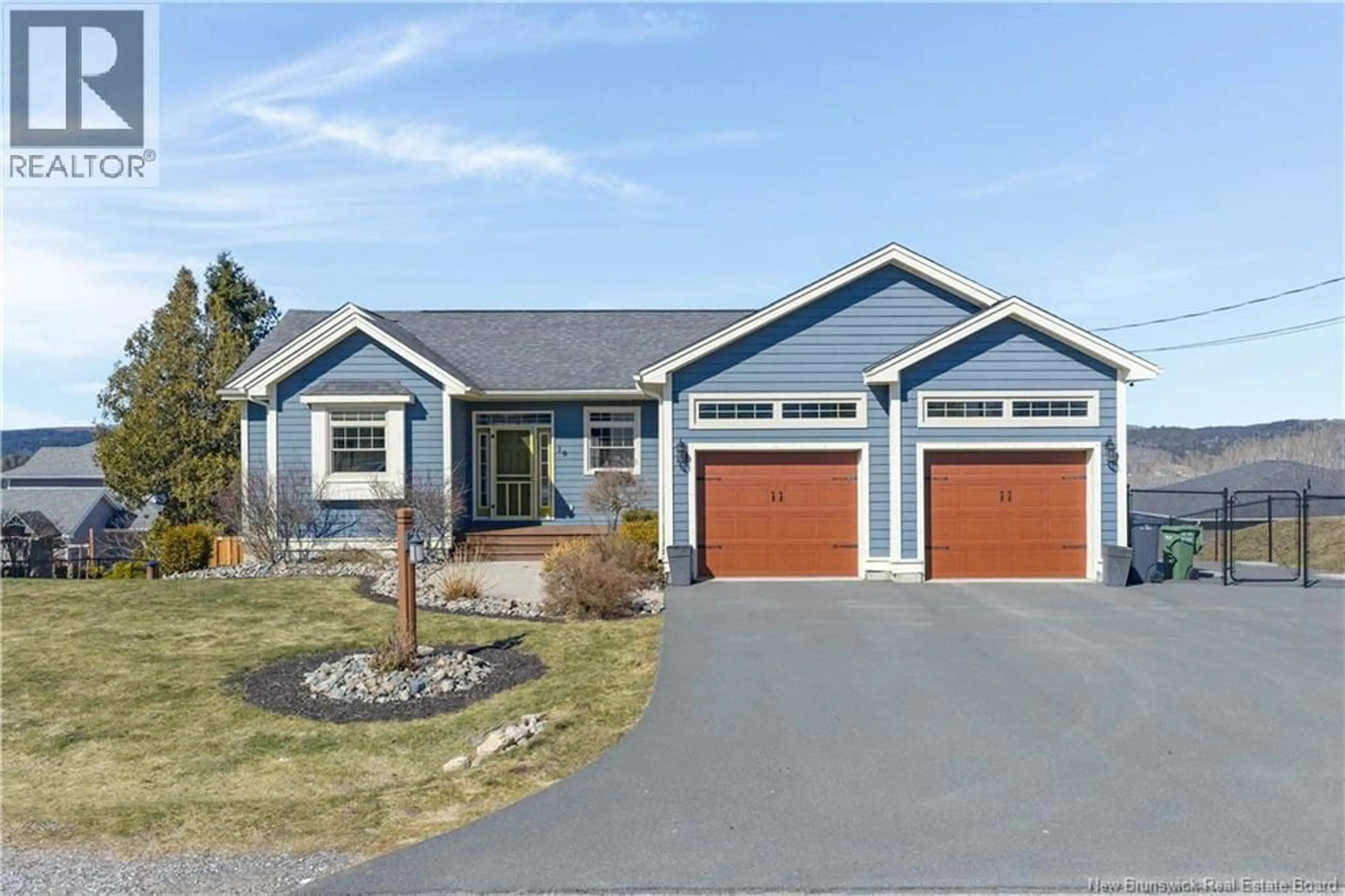 Home with vinyl exterior material, street for 19 PIONEER AVENUE, Quispamsis New Brunswick E2G0B1