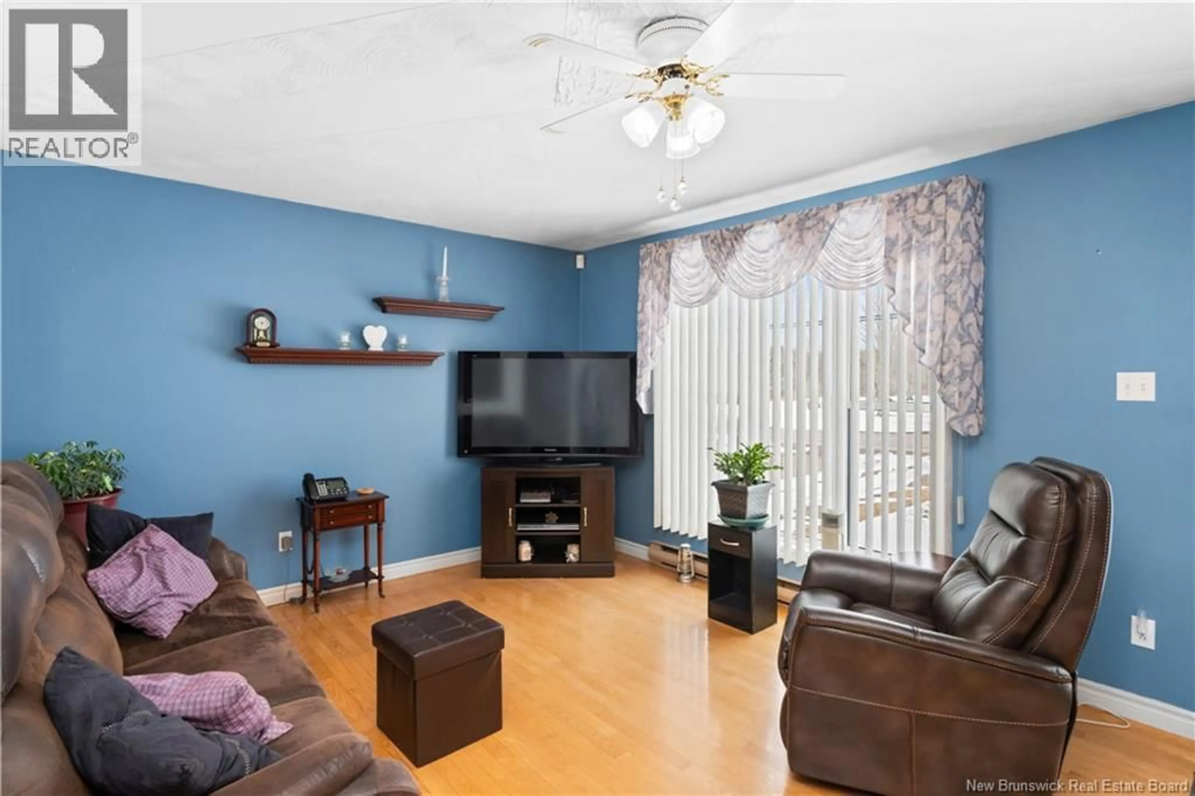 Living room with furniture, wood/laminate floor for 1000 ST ANDRE RD, Saint-Andre-LeBlanc New Brunswick E4P6E9