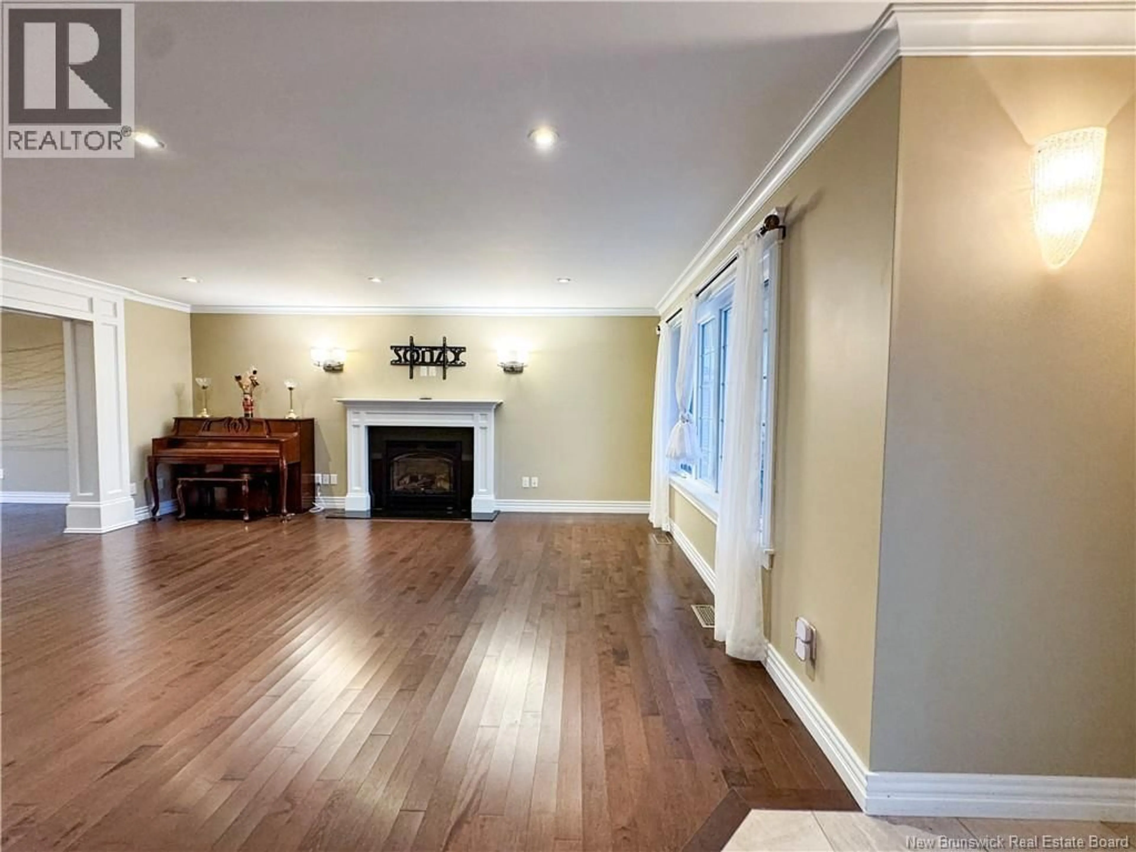 Living room with furniture, wood/laminate floor for 145 AMIENS DRIVE, Moncton New Brunswick E1G5R5