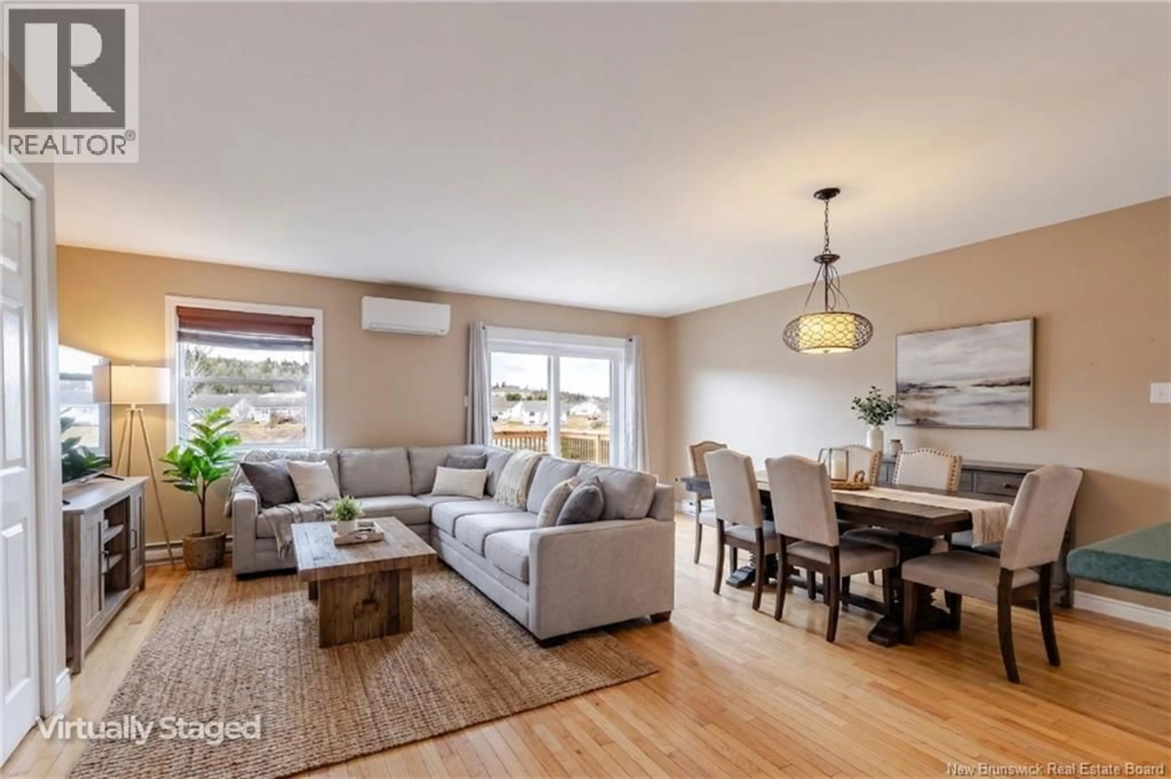 Living room with furniture, wood/laminate floor for 295 BOARS HEAD ROAD, Saint John New Brunswick E2K5B9
