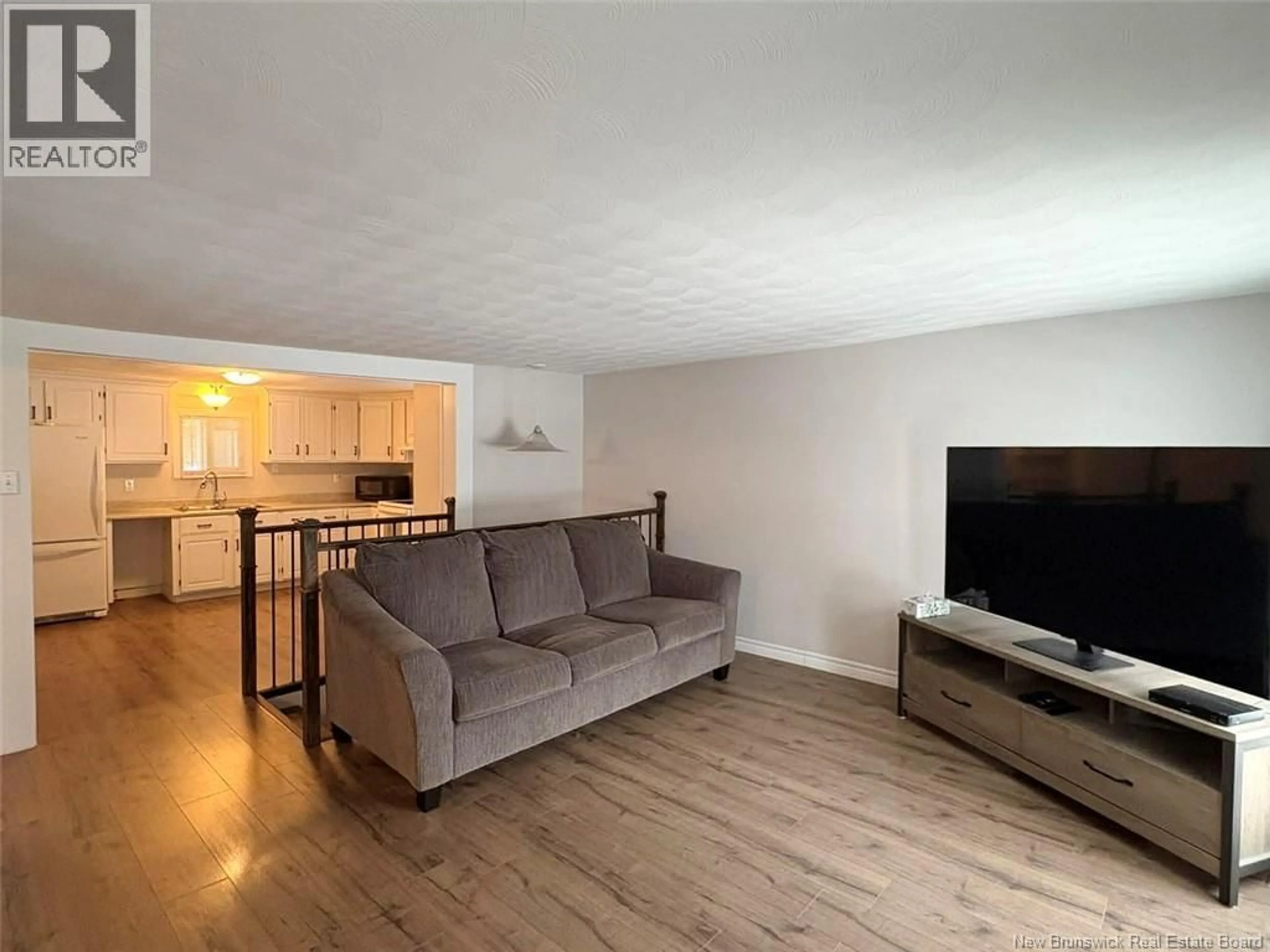 Living room with furniture, wood/laminate floor for 42 HÔTEL DE VILLE STREET, Clair New Brunswick E7A2E9