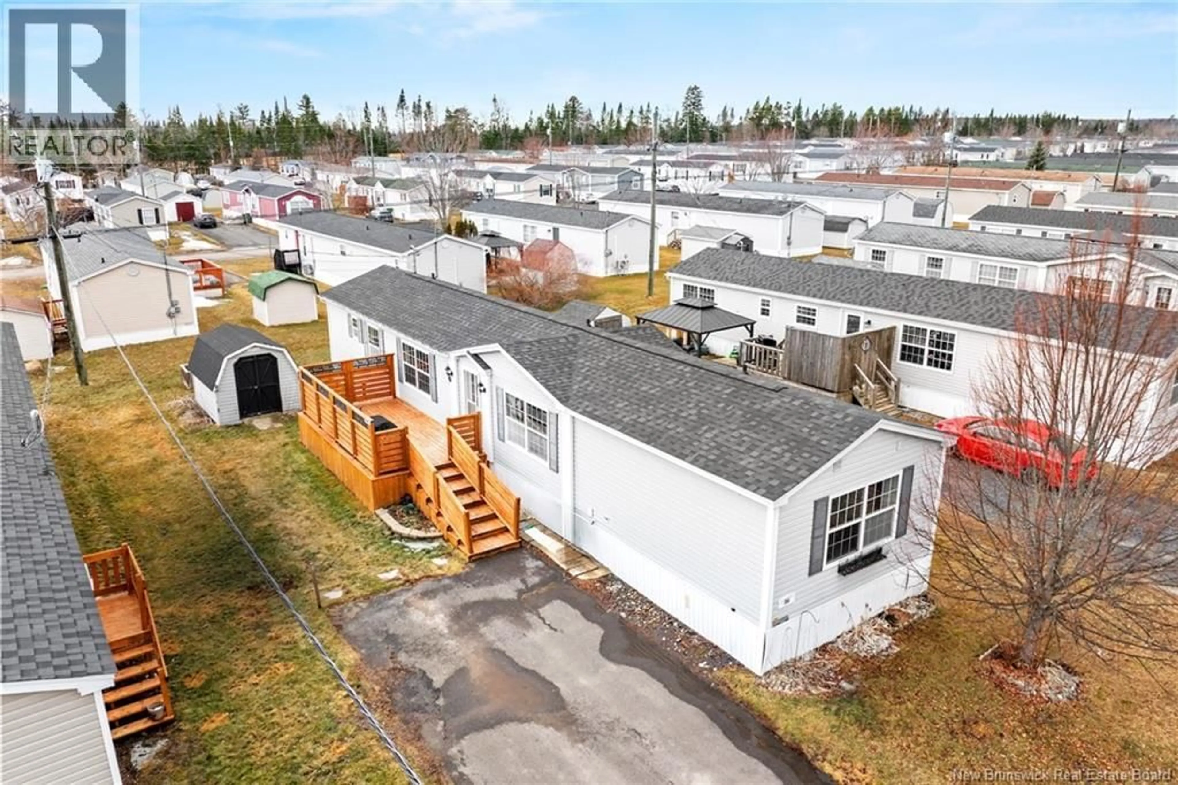 A pic from outside/outdoor area/front of a property/back of a property/a pic from drone, unknown for 86 GLENMAR DRIVE, Fredericton New Brunswick E3G0S3