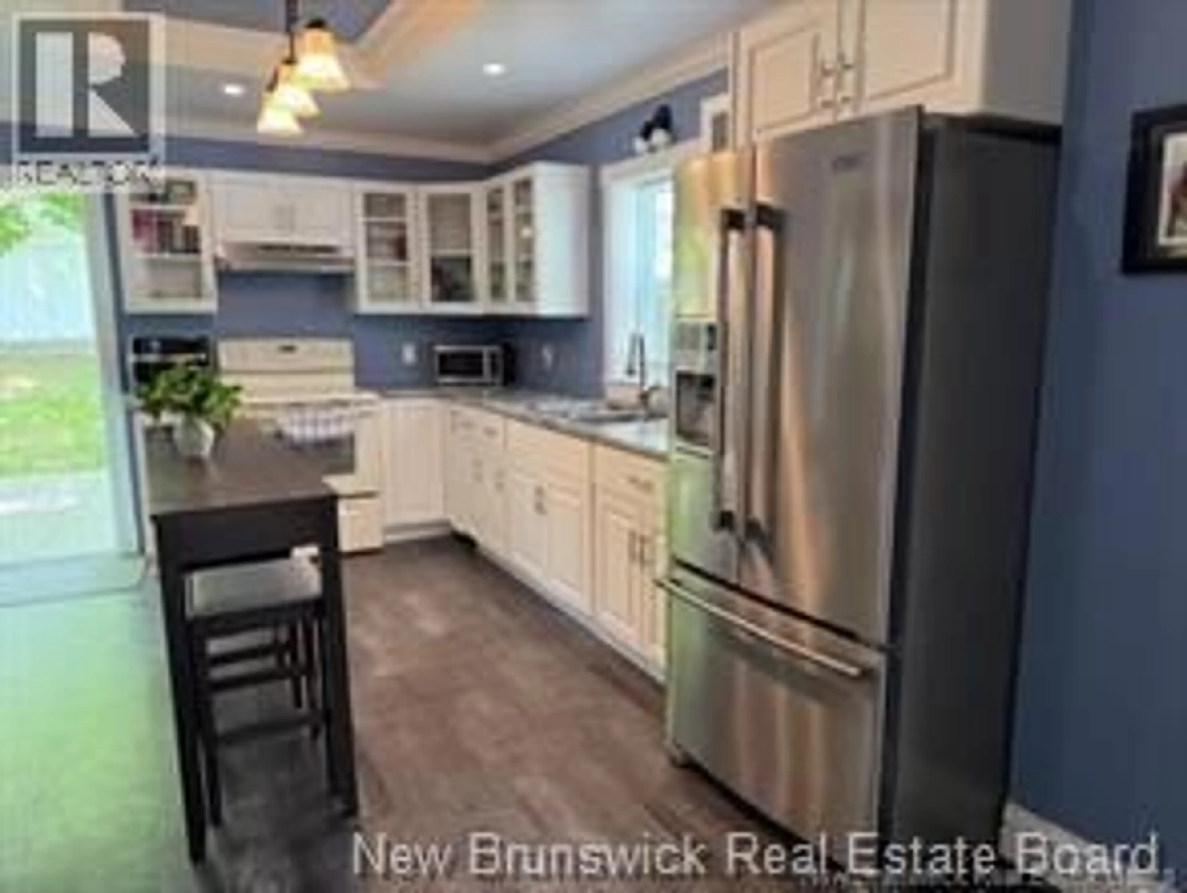 Open concept kitchen, wood/laminate floor for 519 KING GEORGE HWY, Miramichi New Brunswick E1V1M9