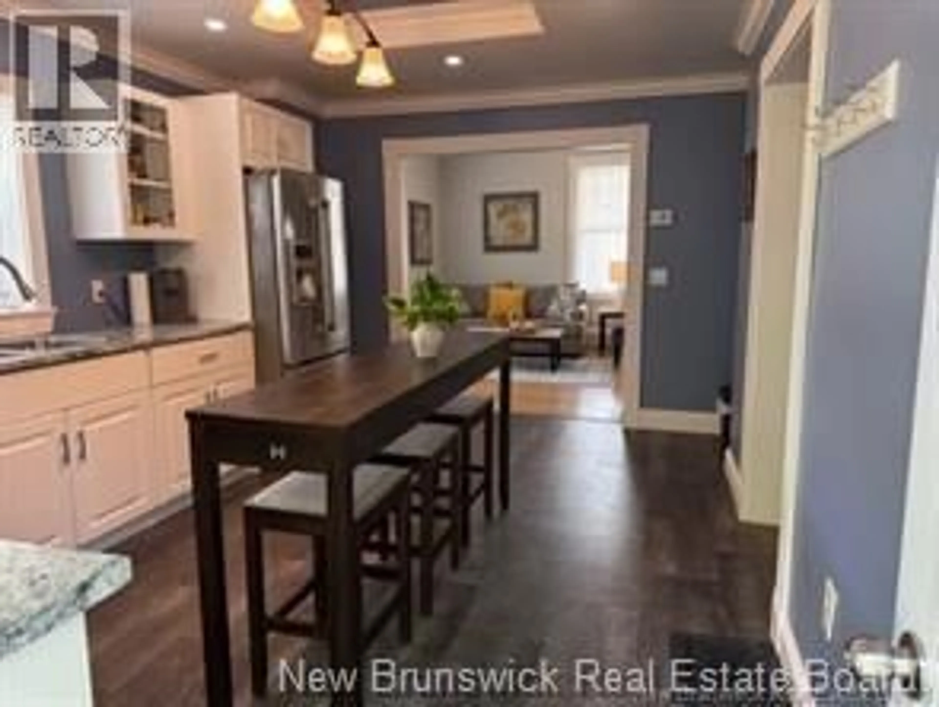 Open concept kitchen, wood/laminate floor for 519 KING GEORGE HWY, Miramichi New Brunswick E1V1M9