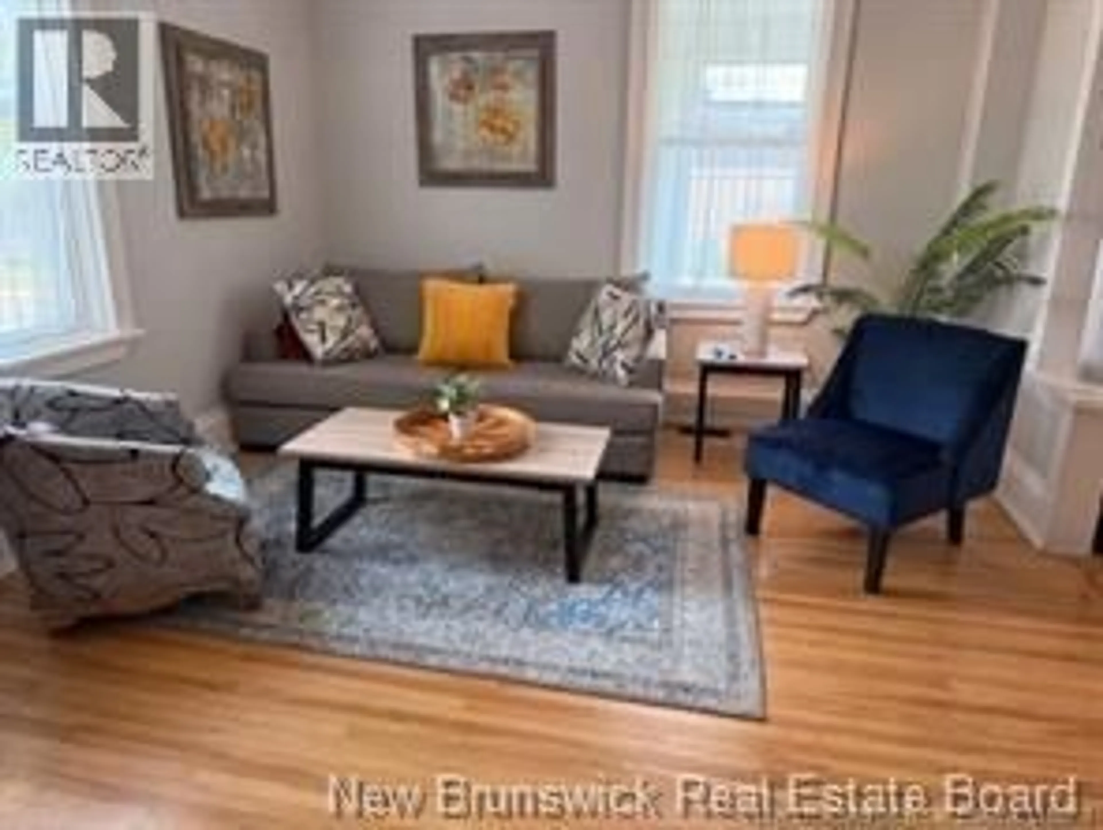 Living room with furniture, wood/laminate floor for 519 KING GEORGE HWY, Miramichi New Brunswick E1V1M9