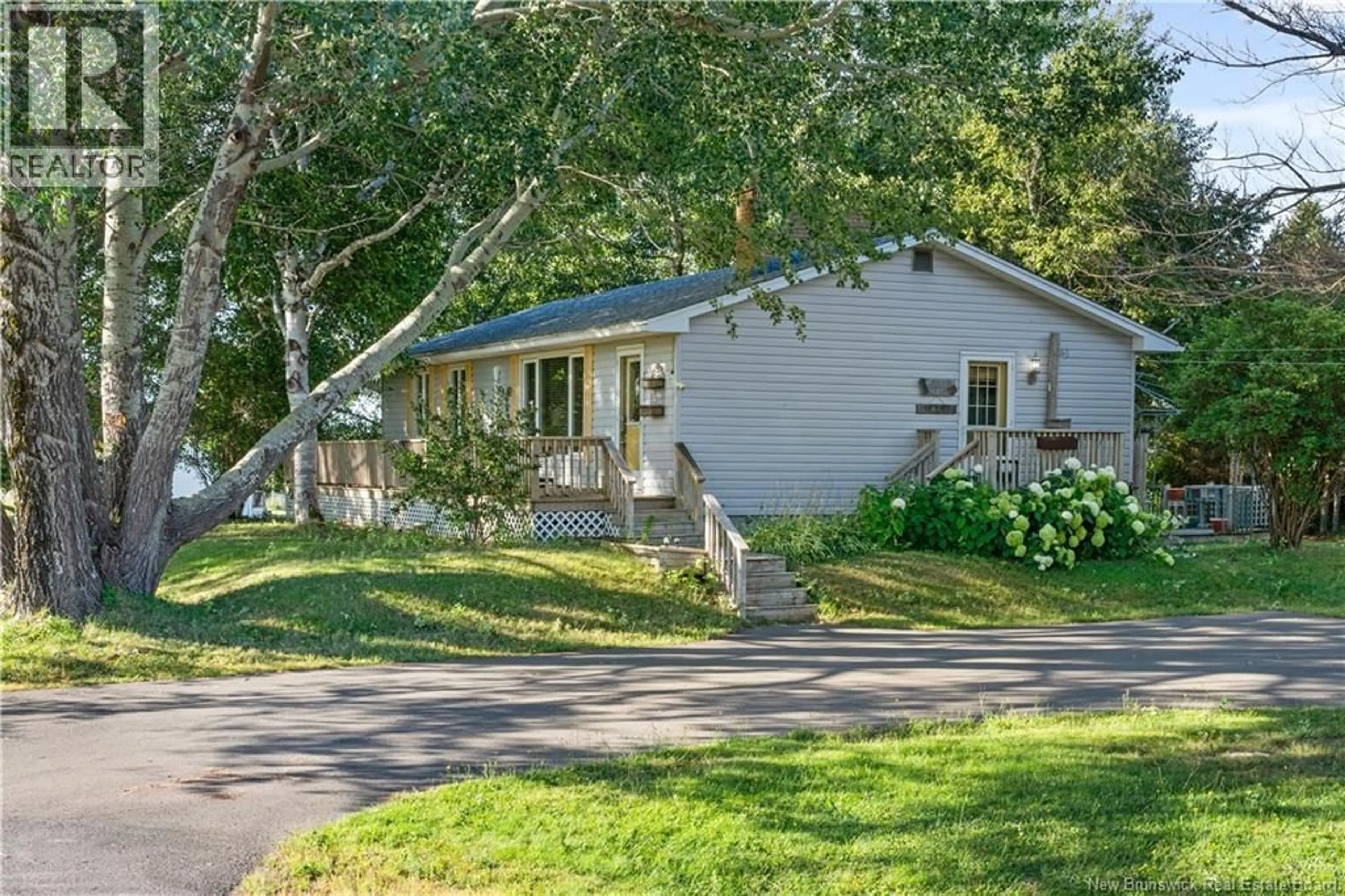 Home with vinyl exterior material, street for 79 DESROCHES ROAD, Bouctouche New Brunswick E4S4L9