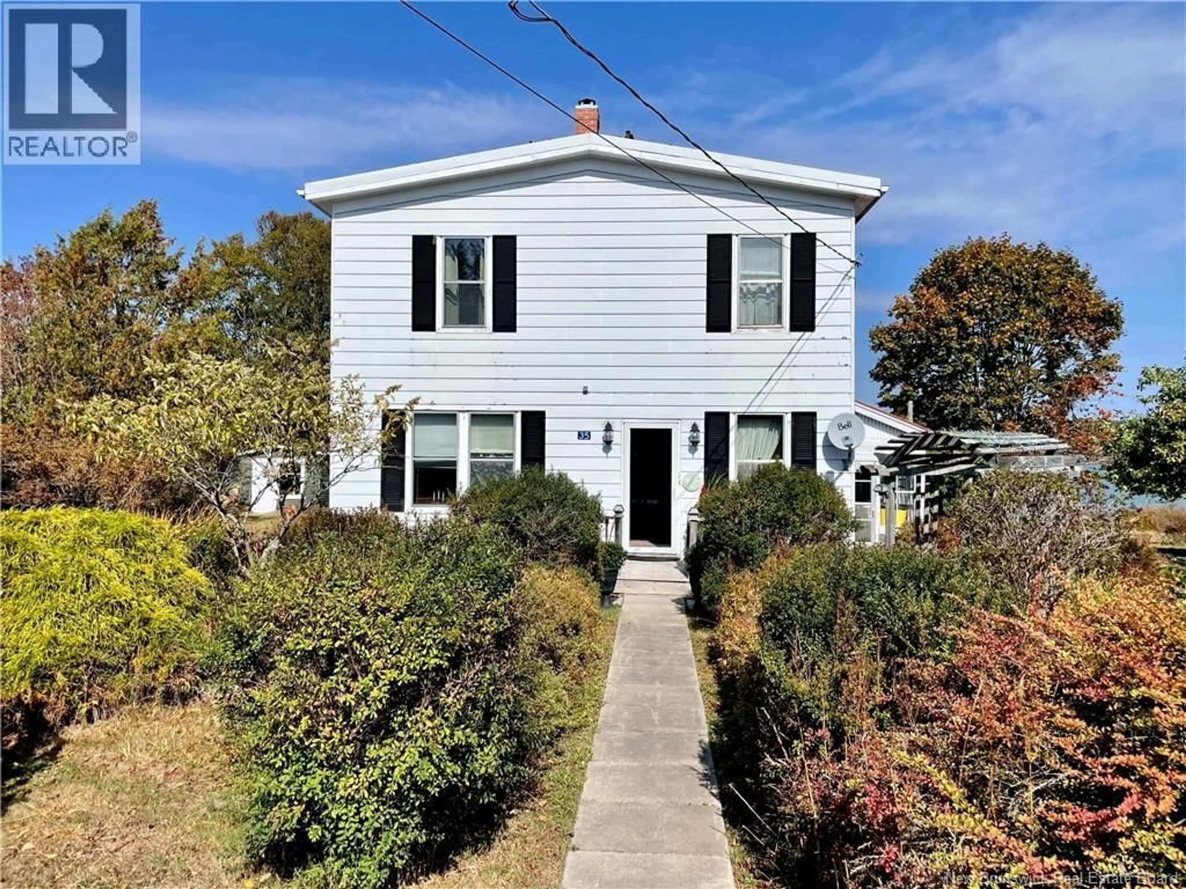 Home with vinyl exterior material, street for 35 DIPPER HARBOUR ROAD, Dipper Harbour New Brunswick E5J1X1