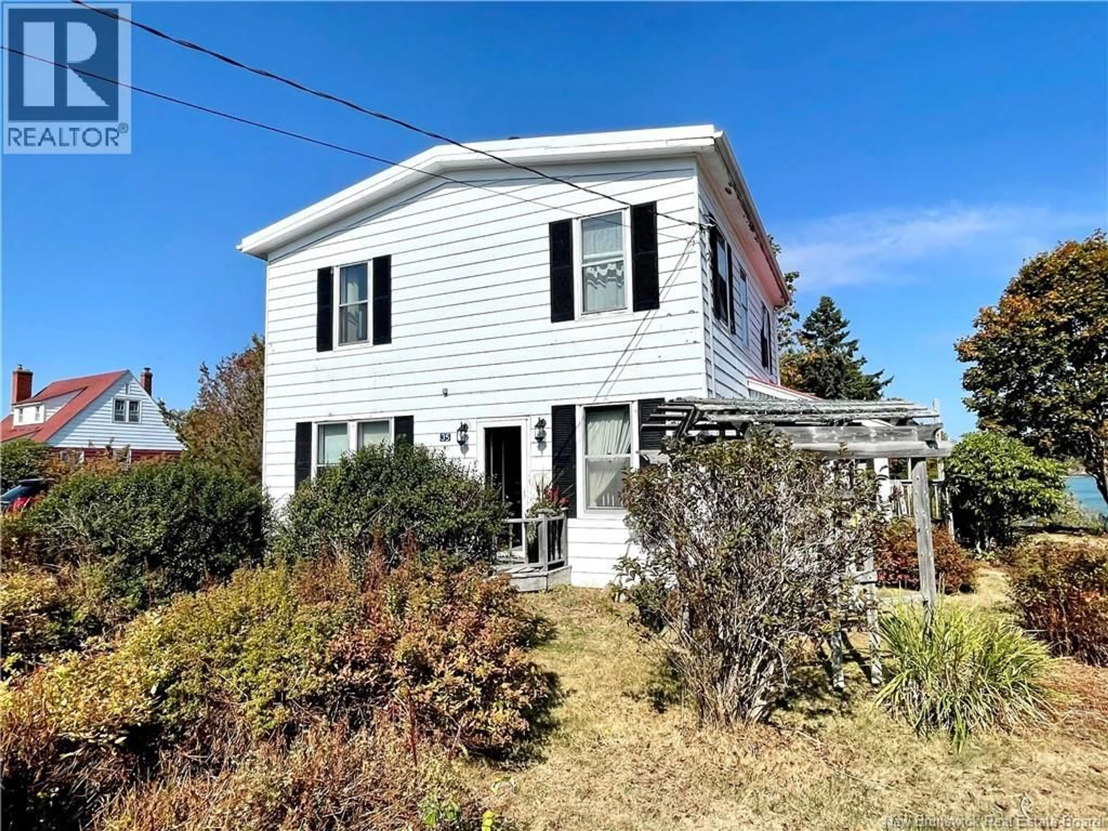 Home with vinyl exterior material, street for 35 DIPPER HARBOUR ROAD, Dipper Harbour New Brunswick E5J1X1