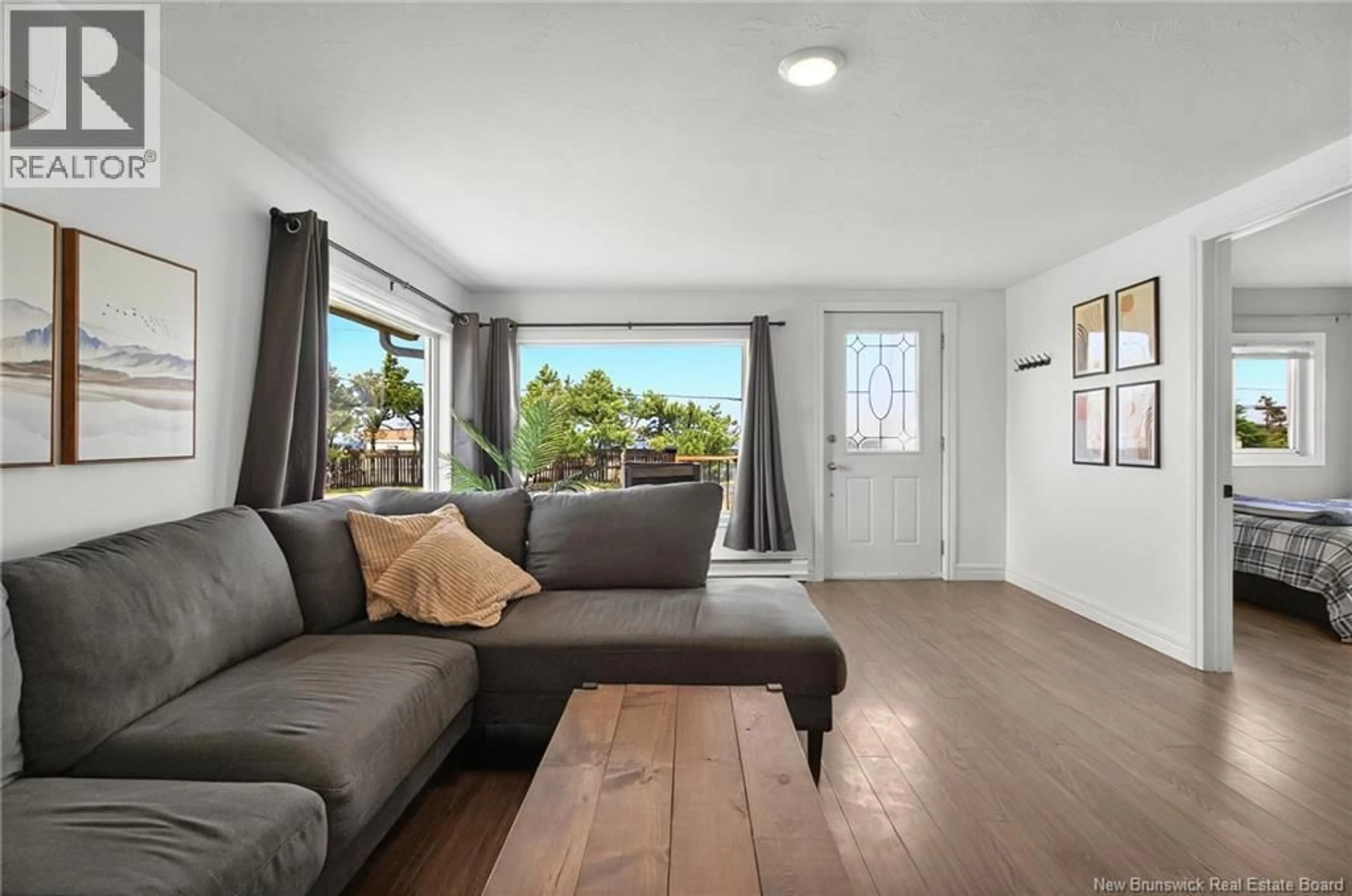 Living room with furniture, wood/laminate floor for 157 DE LA COTE, Grande-Digue New Brunswick E4R1W8