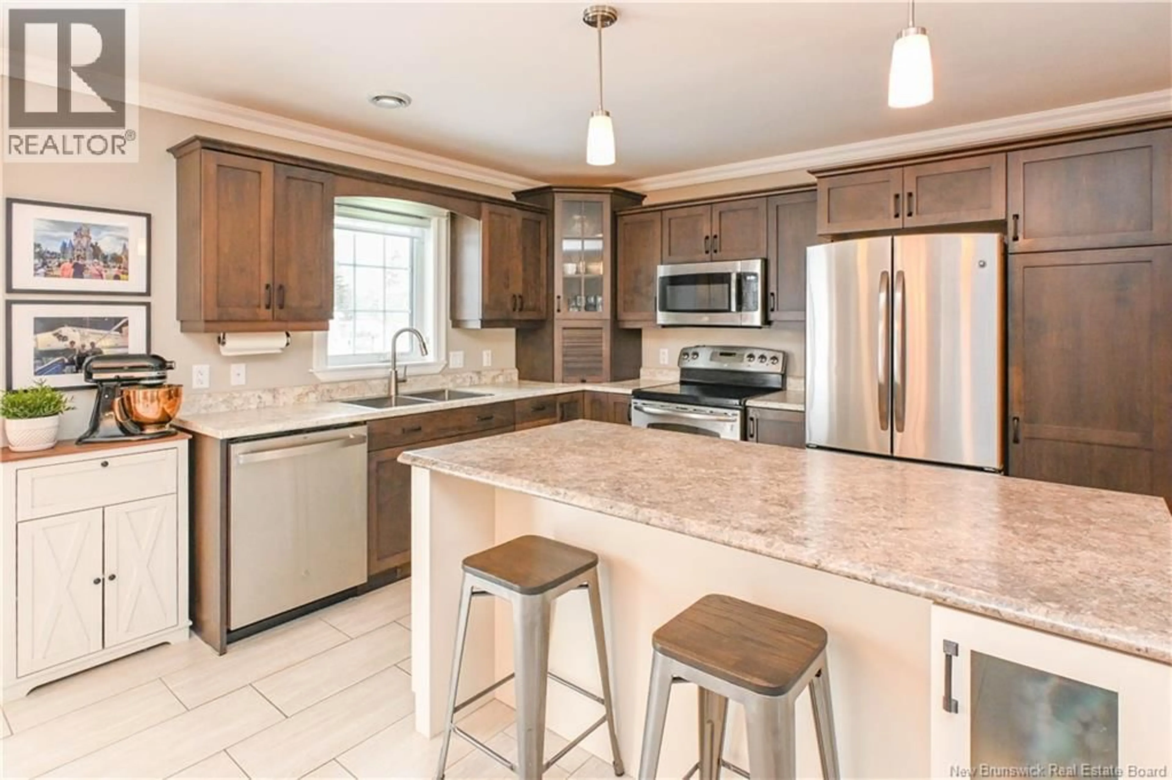 Open concept kitchen, ceramic/tile floor for 201 DES ERABLES STREET, Paquetville New Brunswick E8R1C7