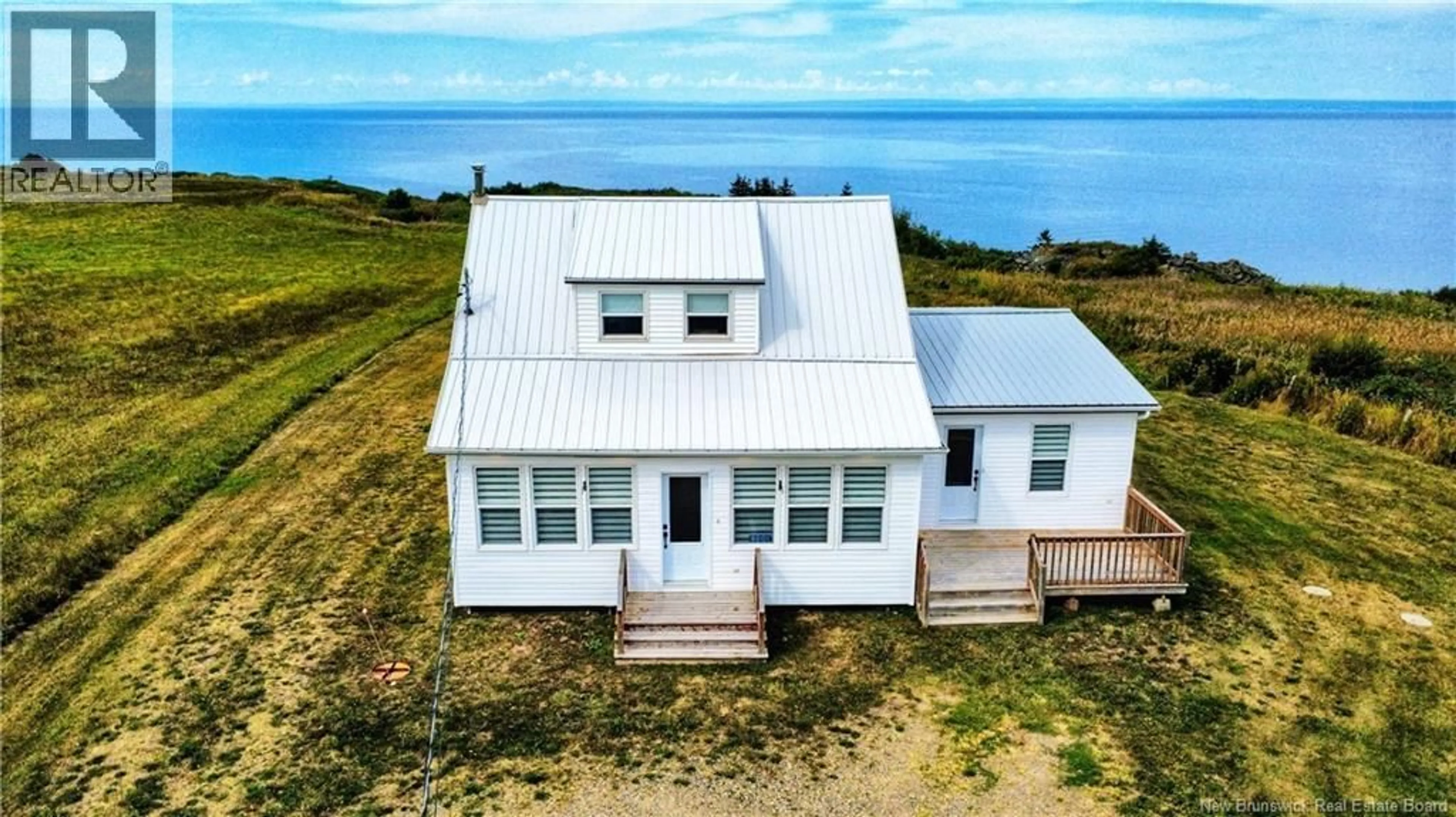 A pic from outside/outdoor area/front of a property/back of a property/a pic from drone, water/lake/river/ocean view for 8201 NB 11, New Bandon New Brunswick E2A5P7