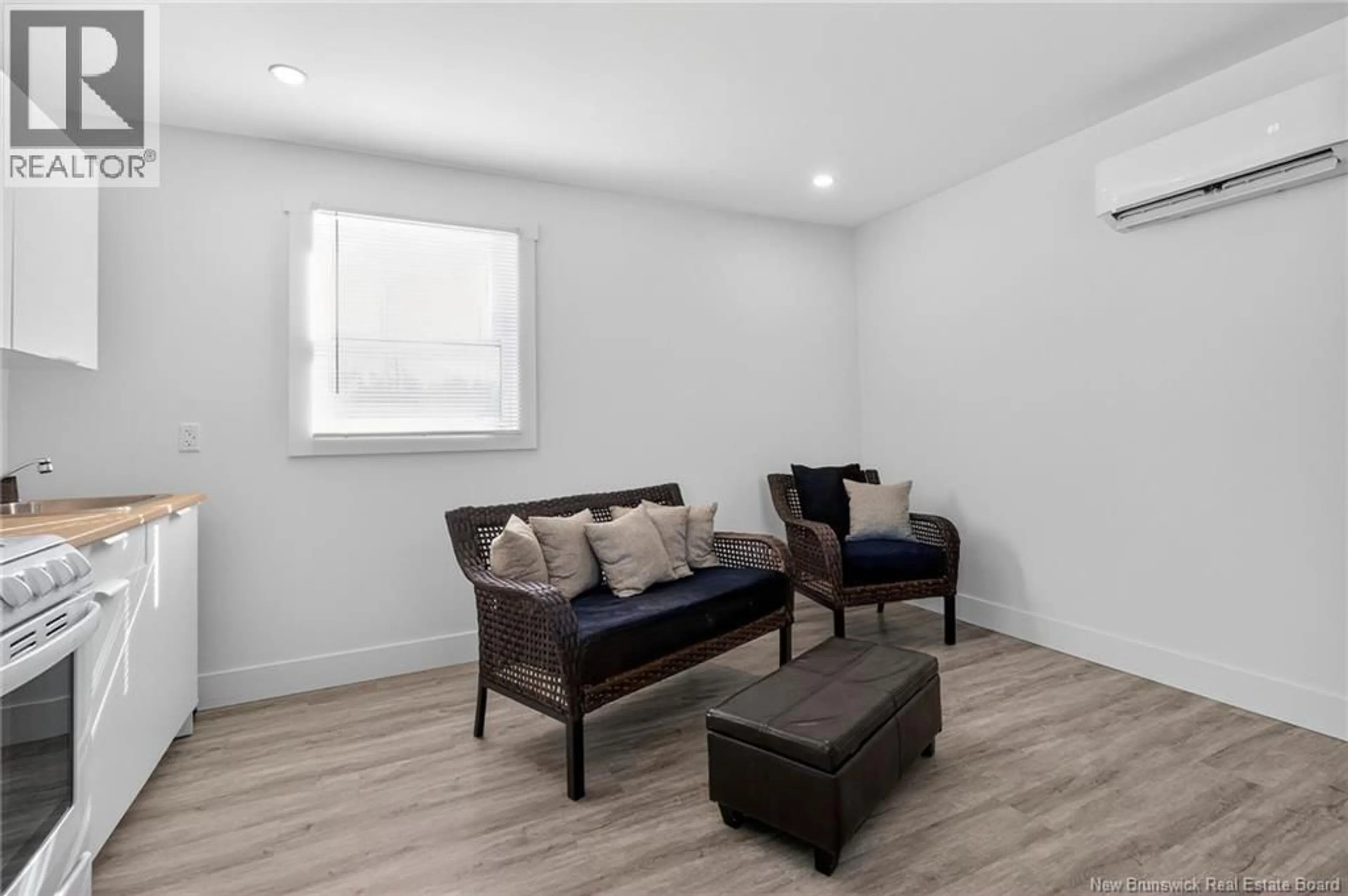 Living room with furniture, wood/laminate floor for 26 LOWER MEADOW ROAD, Scoudouc New Brunswick E4P0A5
