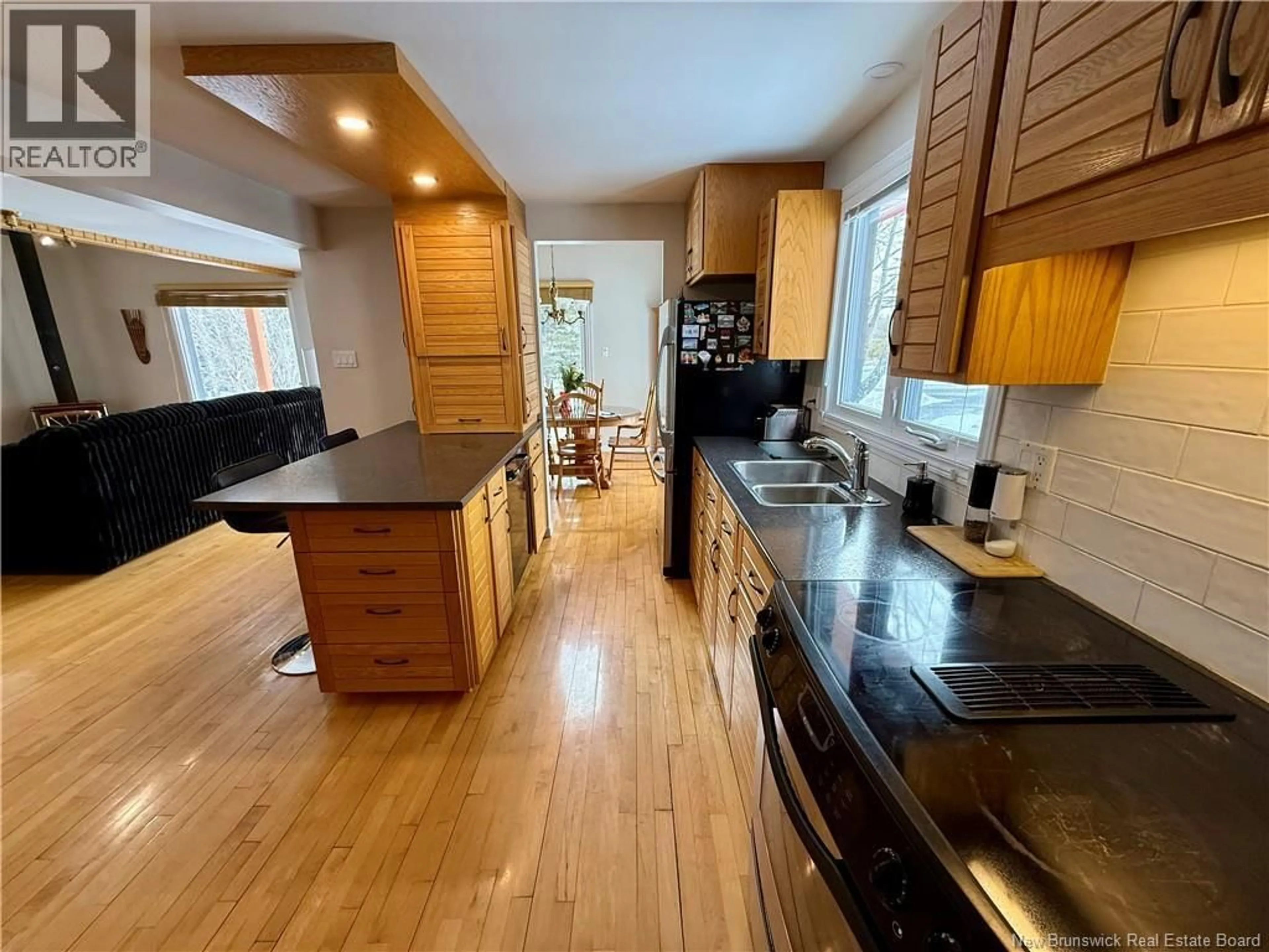 Open concept kitchen, wood/laminate floor for 47 BÉLANGER STREET, Saint-Basile New Brunswick E7C1S7