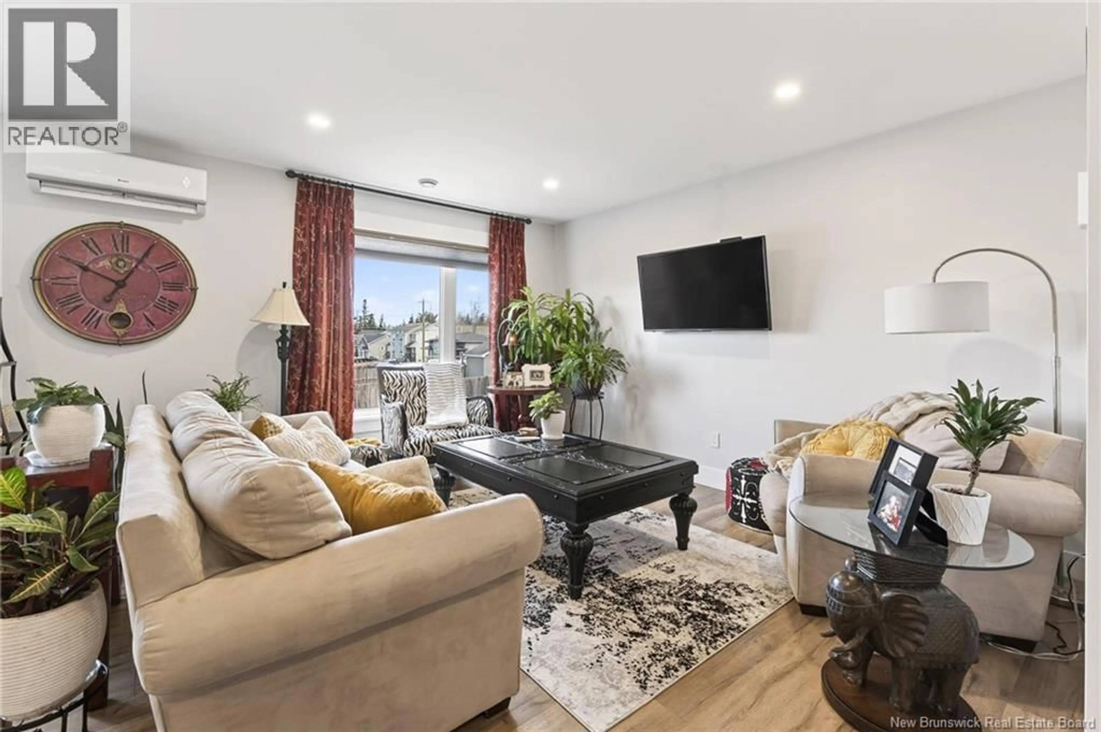 Living room with furniture, wood/laminate floor for 134 DES ERABLES STREET, Dieppe New Brunswick E1A9B2