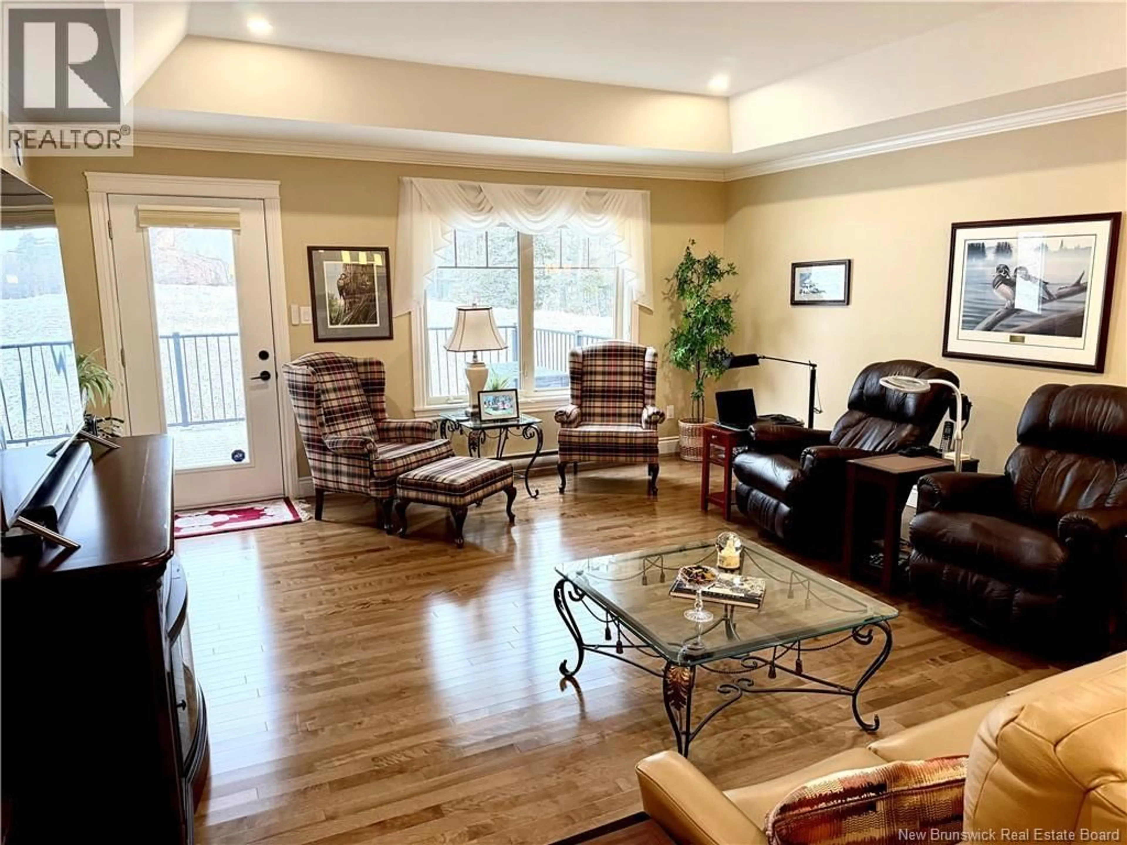 Living room with furniture, wood/laminate floor for 71 BEL-AIRE AVENUE, Rothesay New Brunswick E2E4Y1