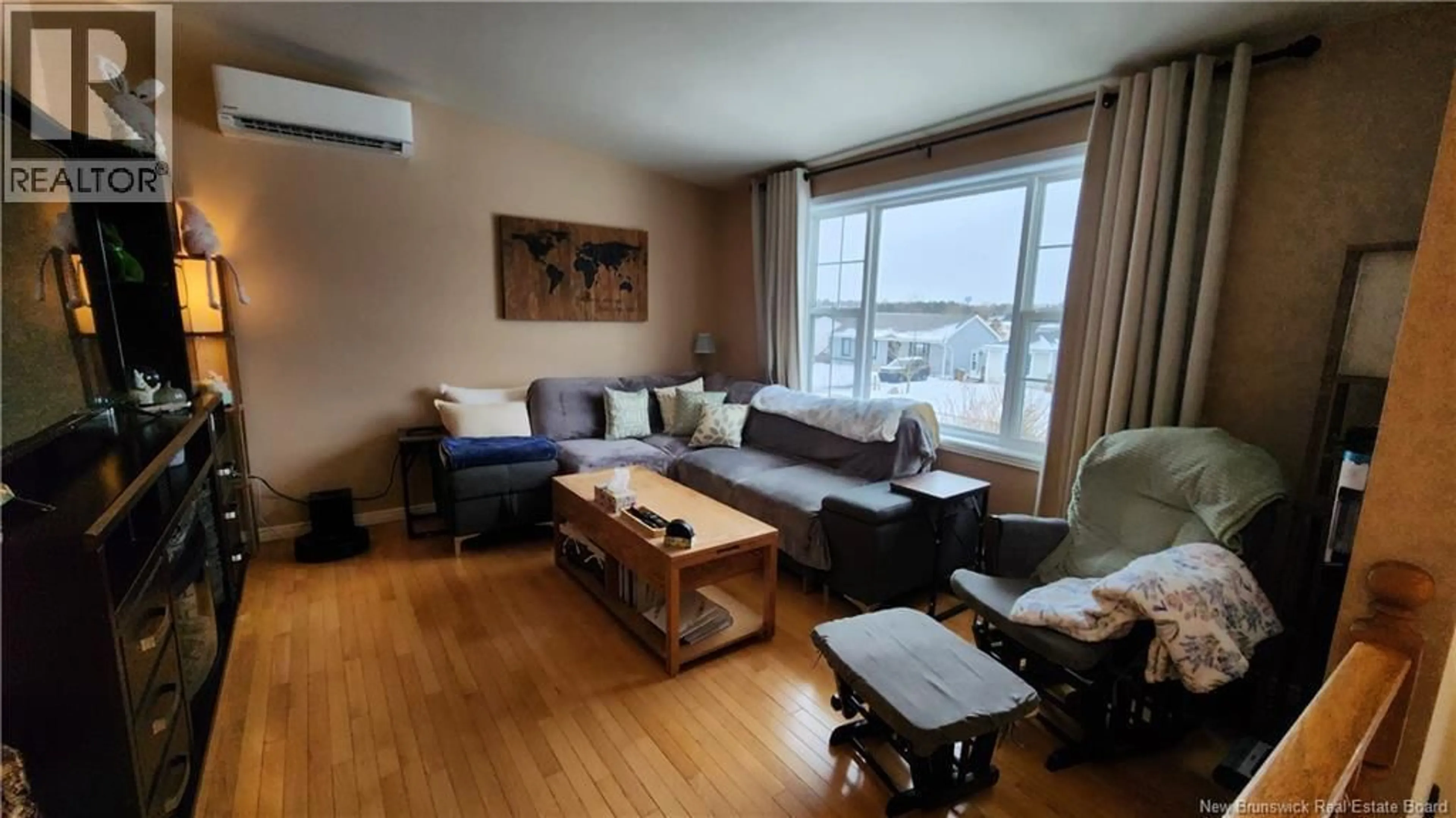 Living room with furniture, wood/laminate floor for 90 HONEYSUCKLE DRIVE, Saint John New Brunswick E2M5T1