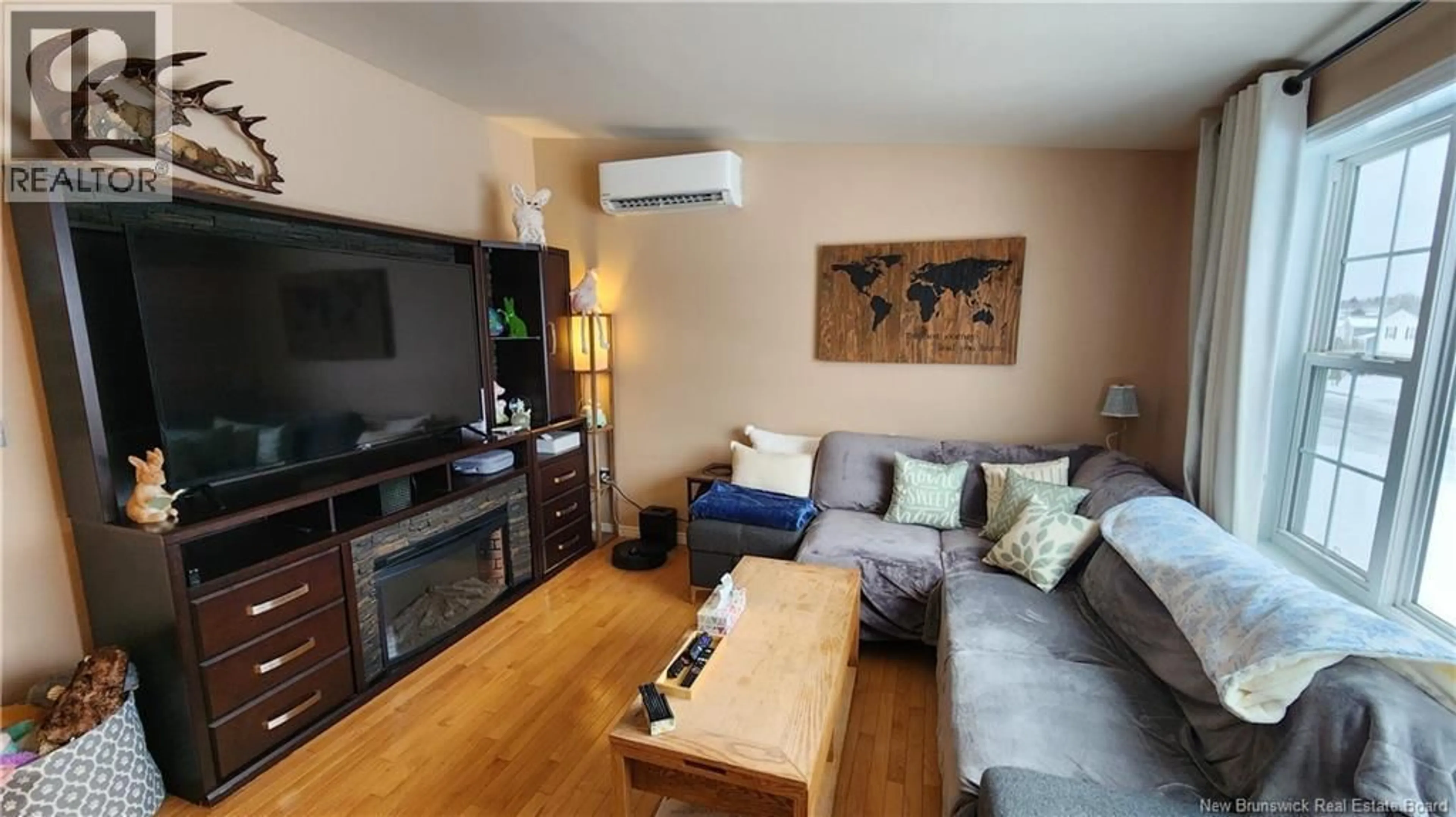 Living room with furniture, wood/laminate floor for 90 HONEYSUCKLE DRIVE, Saint John New Brunswick E2M5T1