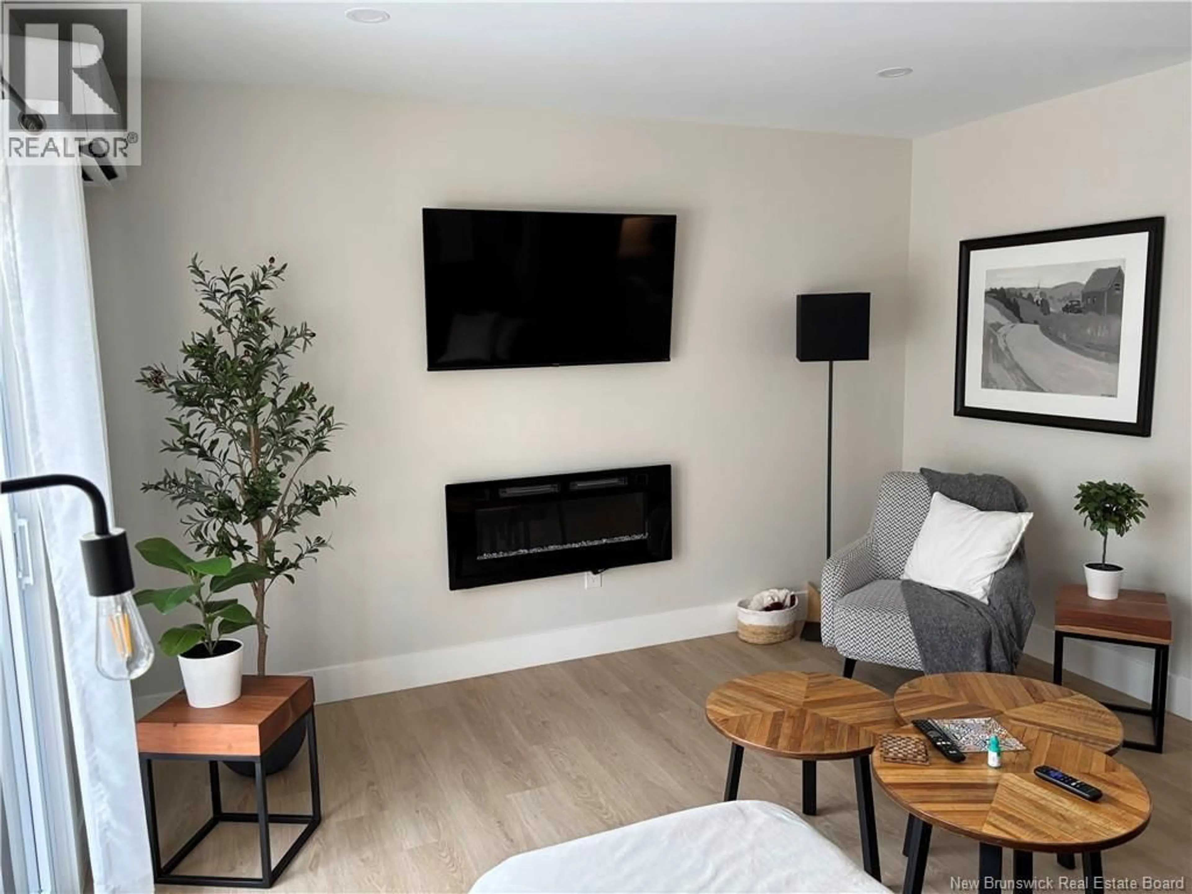 Living room with furniture, wood/laminate floor for 150 ELSLIGER STREET, Dieppe New Brunswick E1K0A5