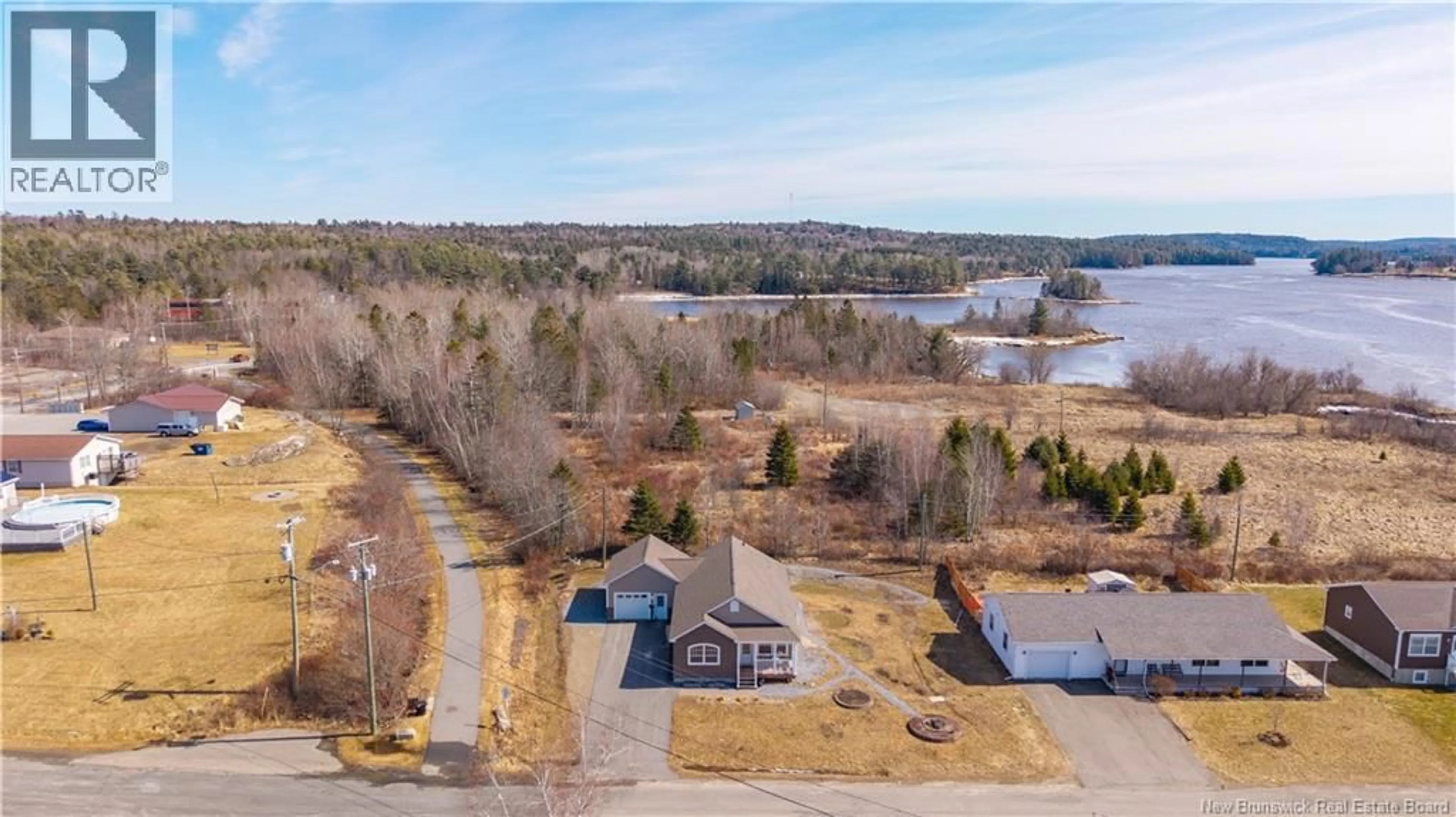A pic from outside/outdoor area/front of a property/back of a property/a pic from drone, water/lake/river/ocean view for 10 RIVER STREET, St. Stephen New Brunswick E3L3H8
