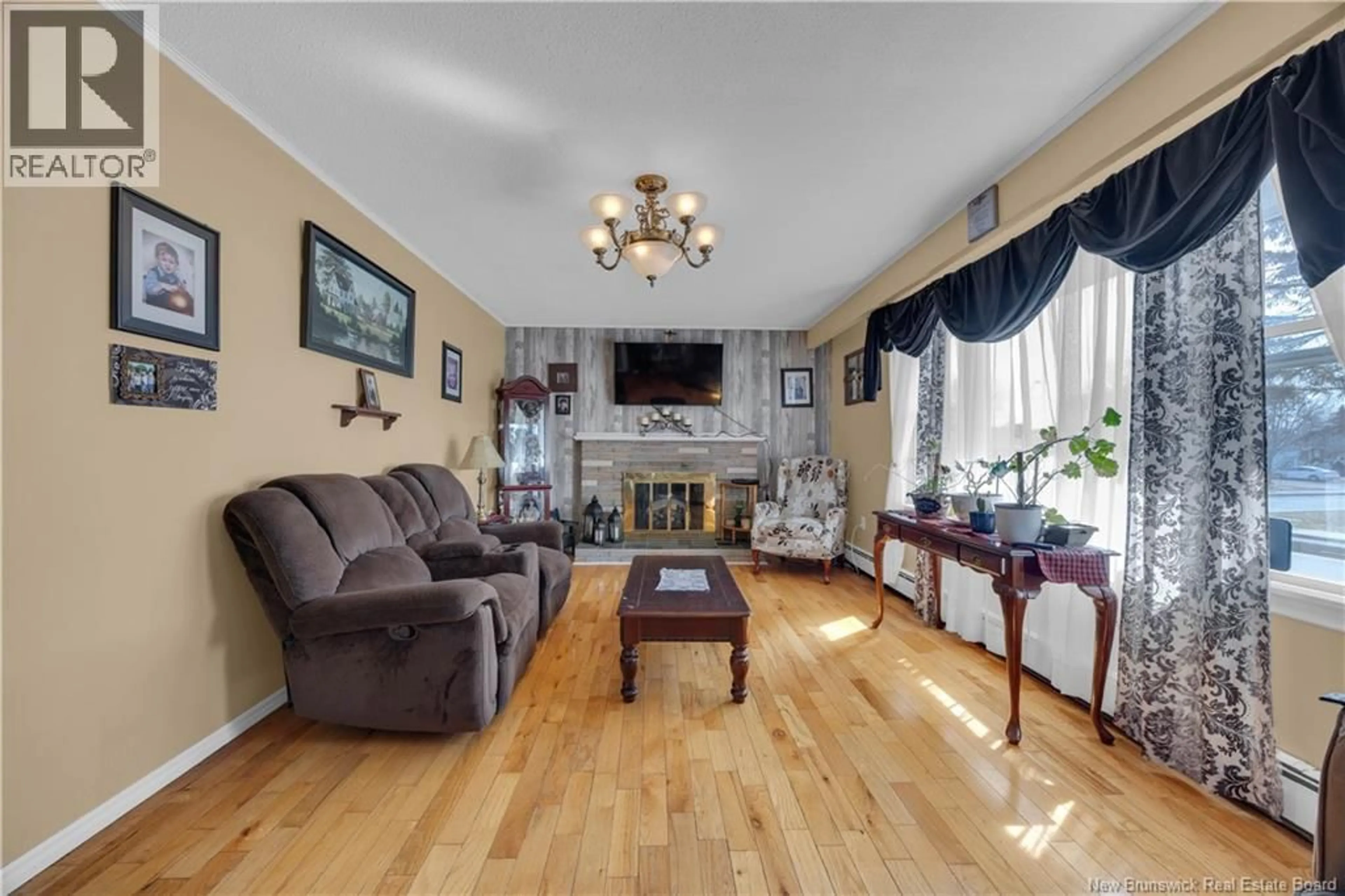 Living room with furniture, wood/laminate floor for 2 SYLVIA DRIVE, Saint John New Brunswick E2J3K1