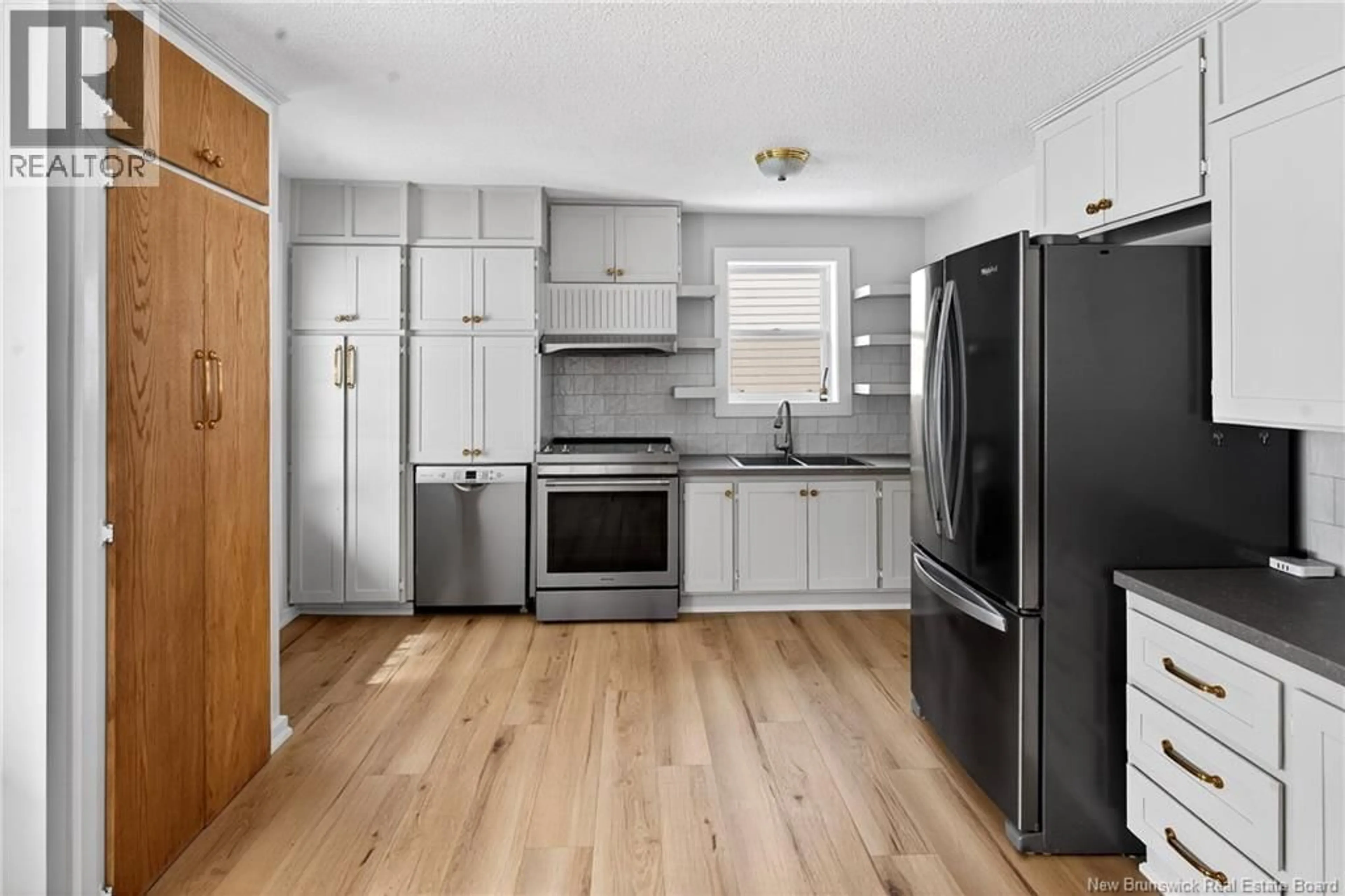 Open concept kitchen, wood/laminate floor for 543 MONTGOMERY STREET, Dalhousie New Brunswick E8C2B5