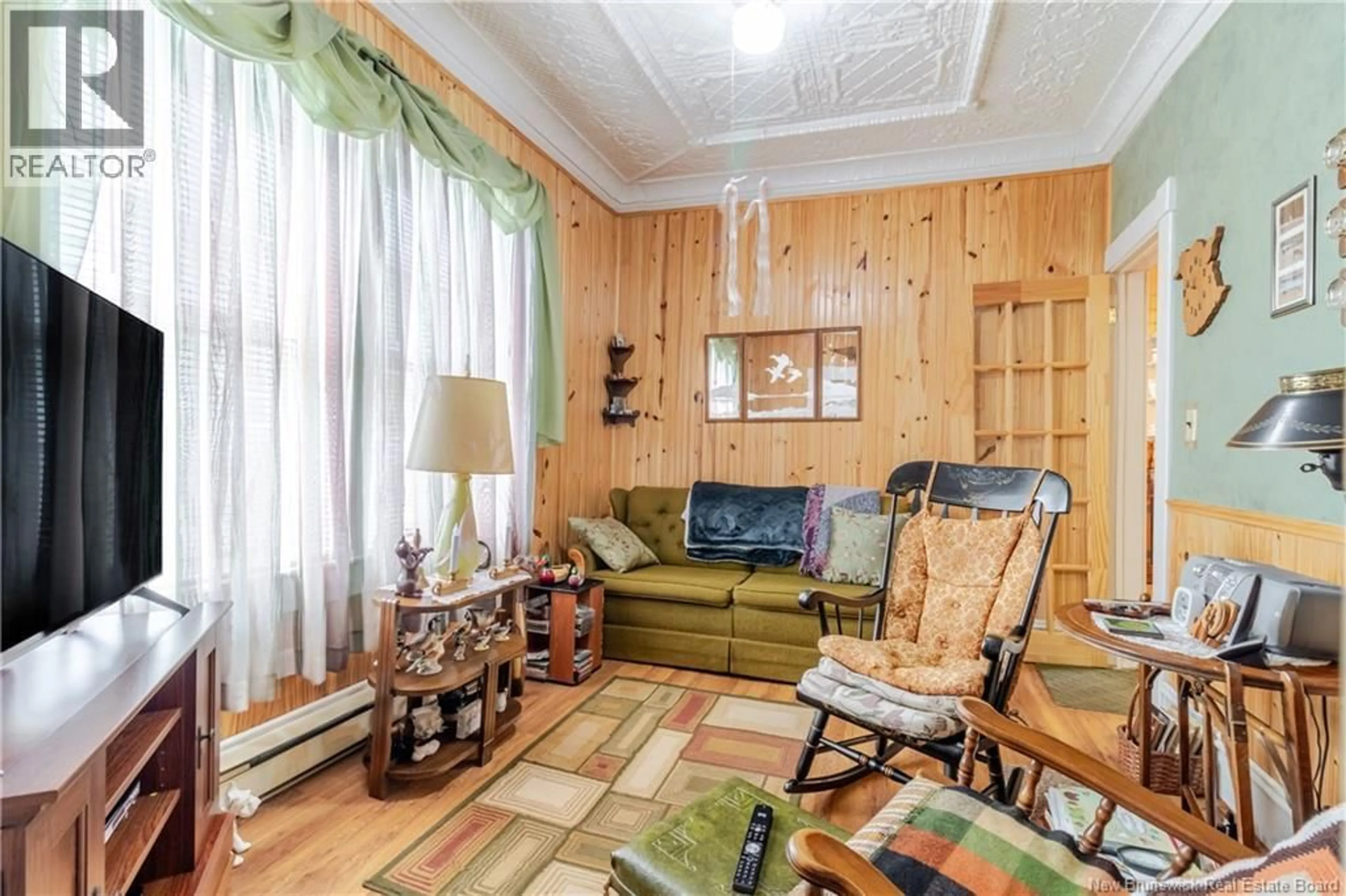 Living room with furniture, wood/laminate floor for 406 MAIN STREET, Hartland New Brunswick E7P2N4