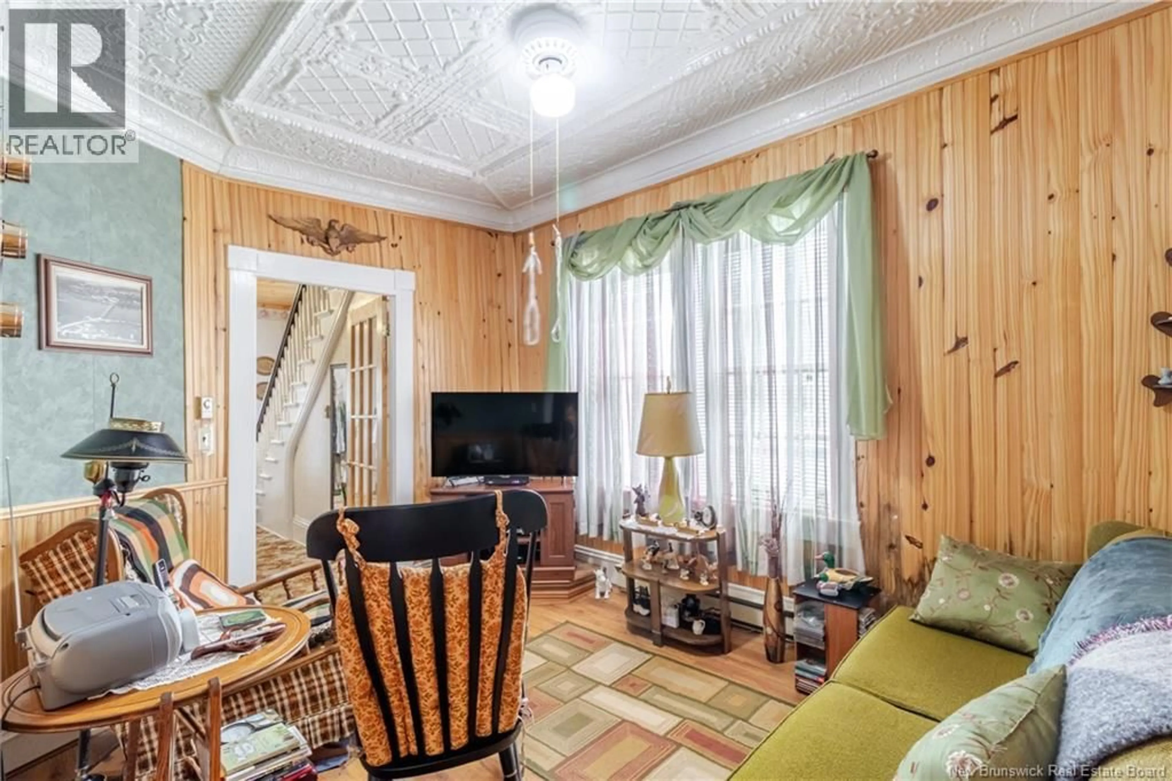 Living room with furniture, wood/laminate floor for 406 MAIN STREET, Hartland New Brunswick E7P2N4