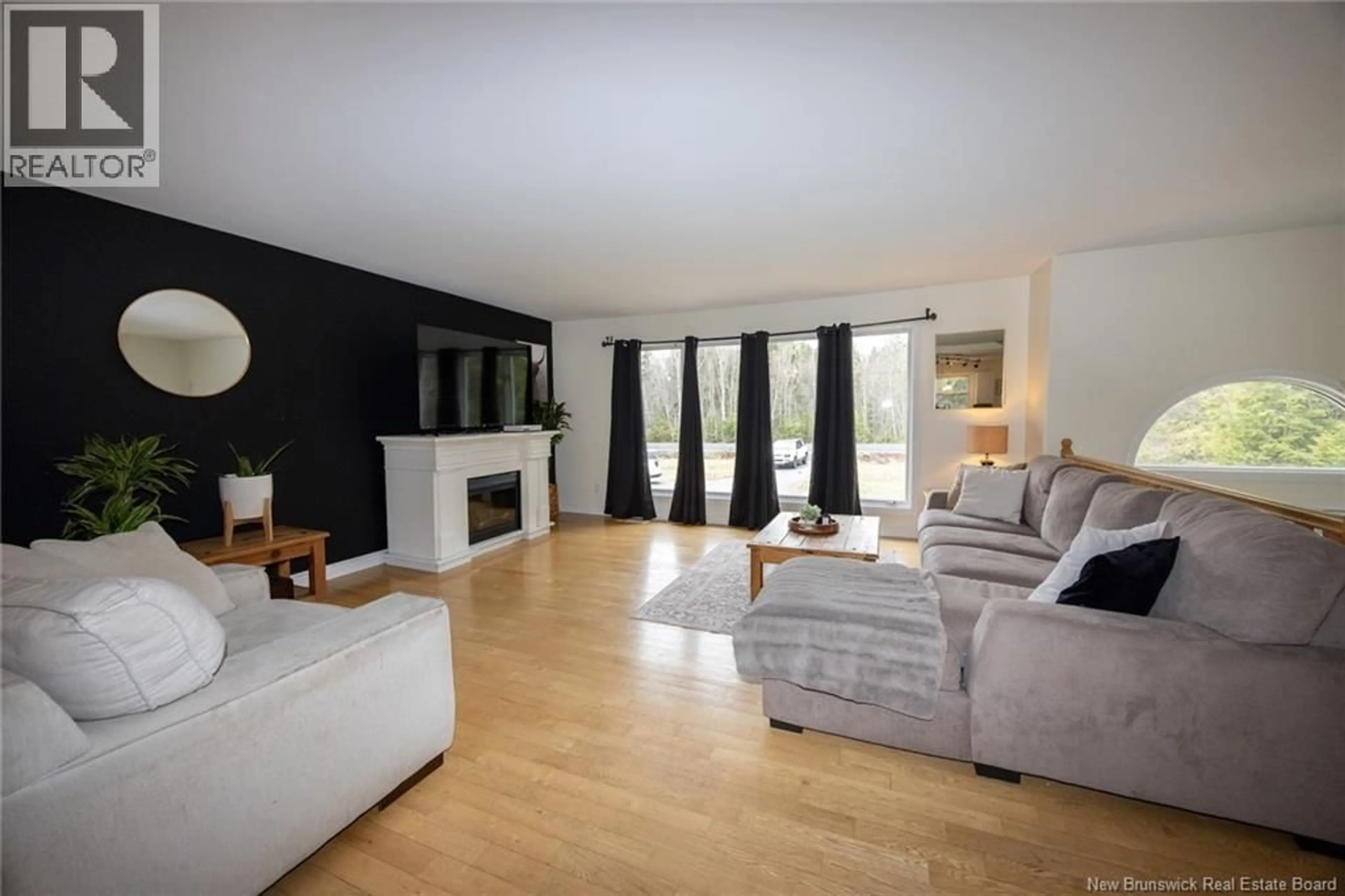 Living room with furniture, wood/laminate floor for 20 BURTON EVERGREEN DRIVE, Burton New Brunswick E2V3E7