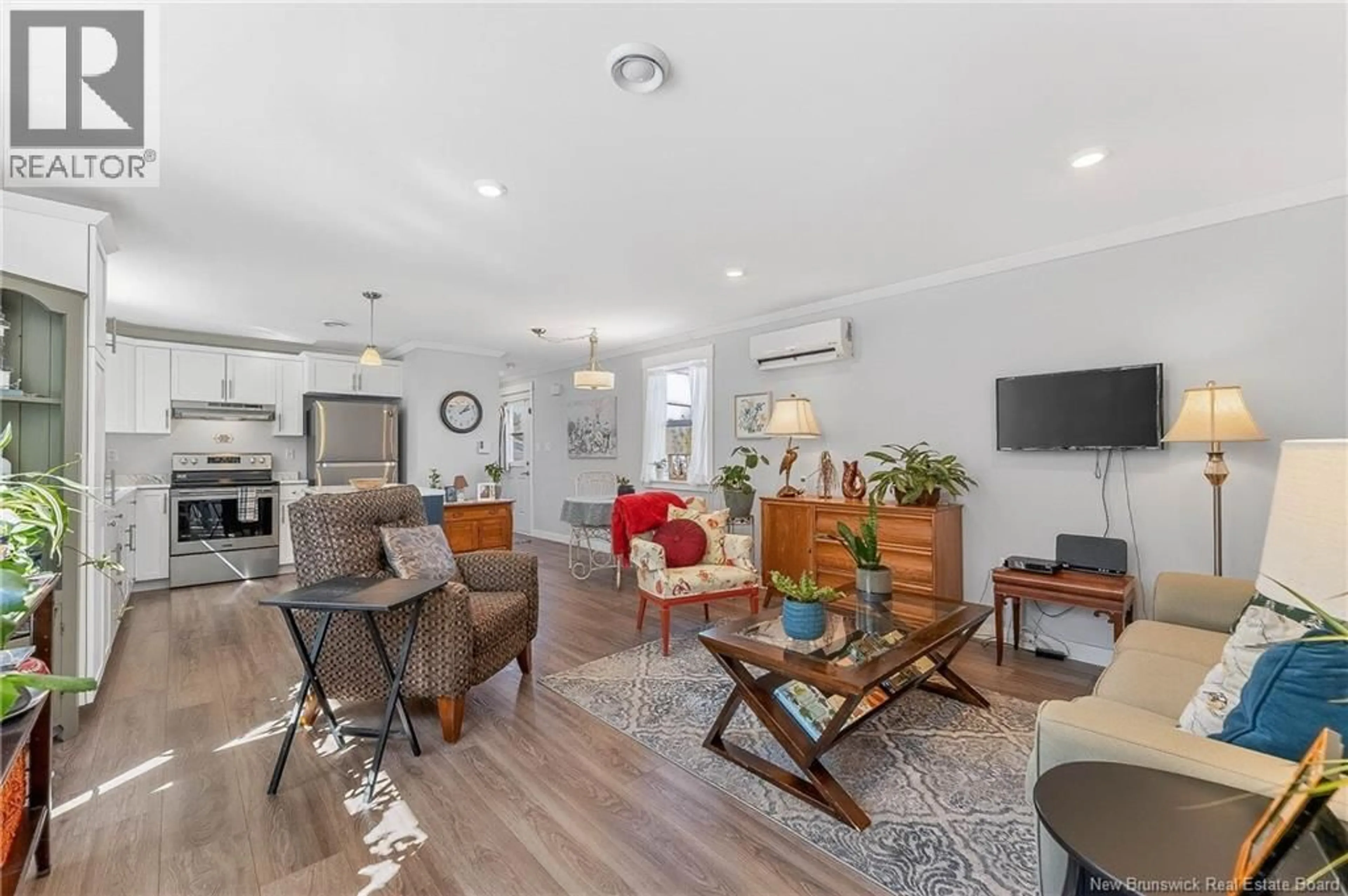 Living room with furniture, wood/laminate floor for 2 WILDWOOD STREET, St. Stephen New Brunswick E3L2Z5