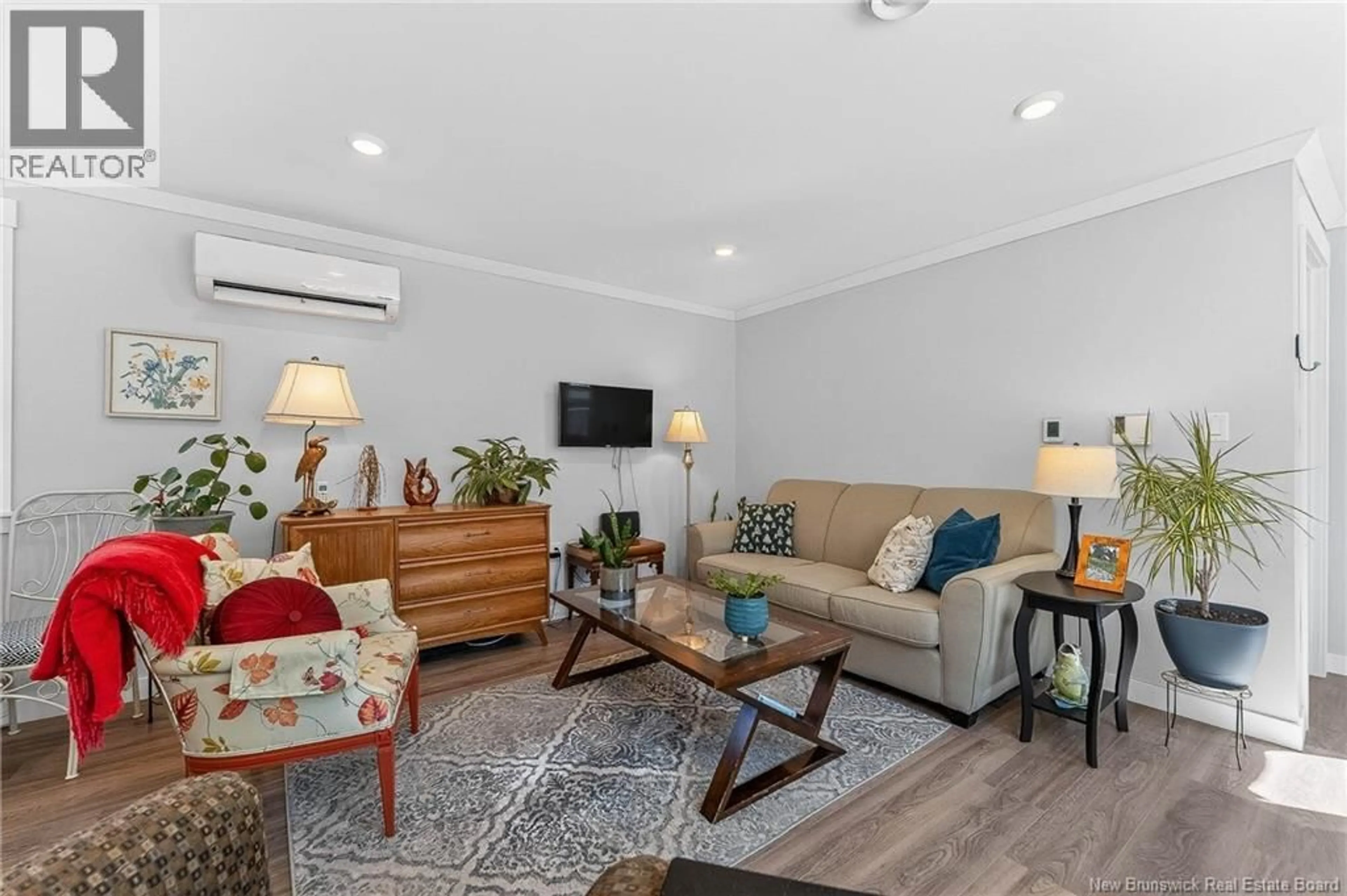 Living room with furniture, wood/laminate floor for 2 WILDWOOD STREET, St. Stephen New Brunswick E3L2Z5