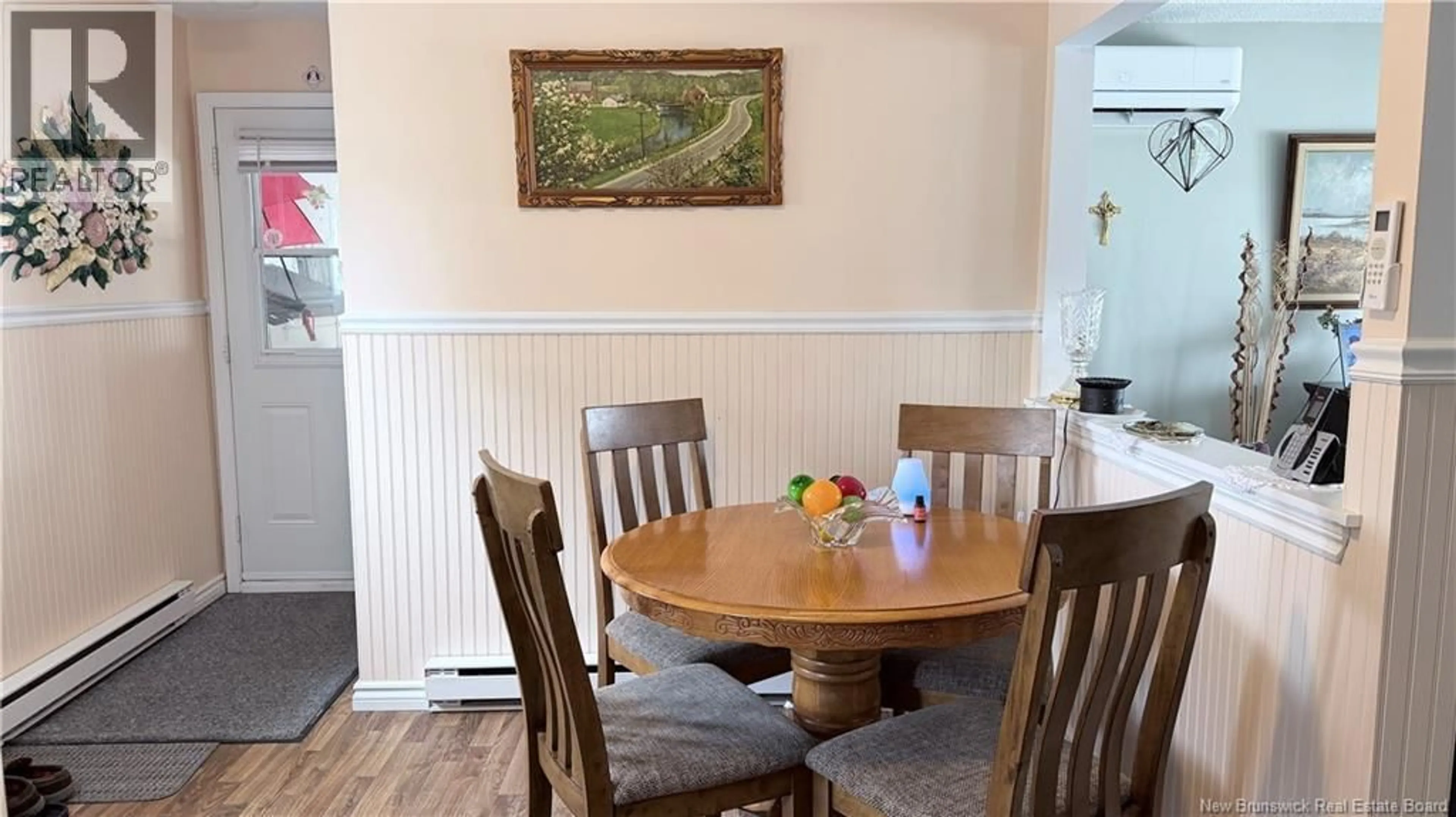 Dining room, wood/laminate floor for 77 RUE NADEAU, Saint-Léonard New Brunswick E7E2E7