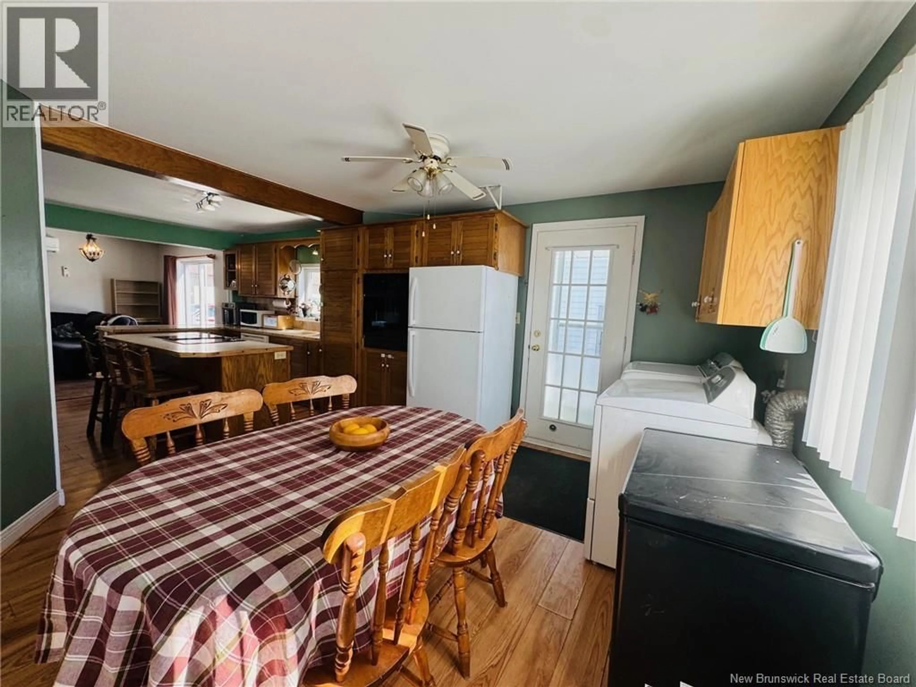 Open concept kitchen, wood/laminate floor for 2 GERRARD STREET, Campbellton New Brunswick E3N2X6