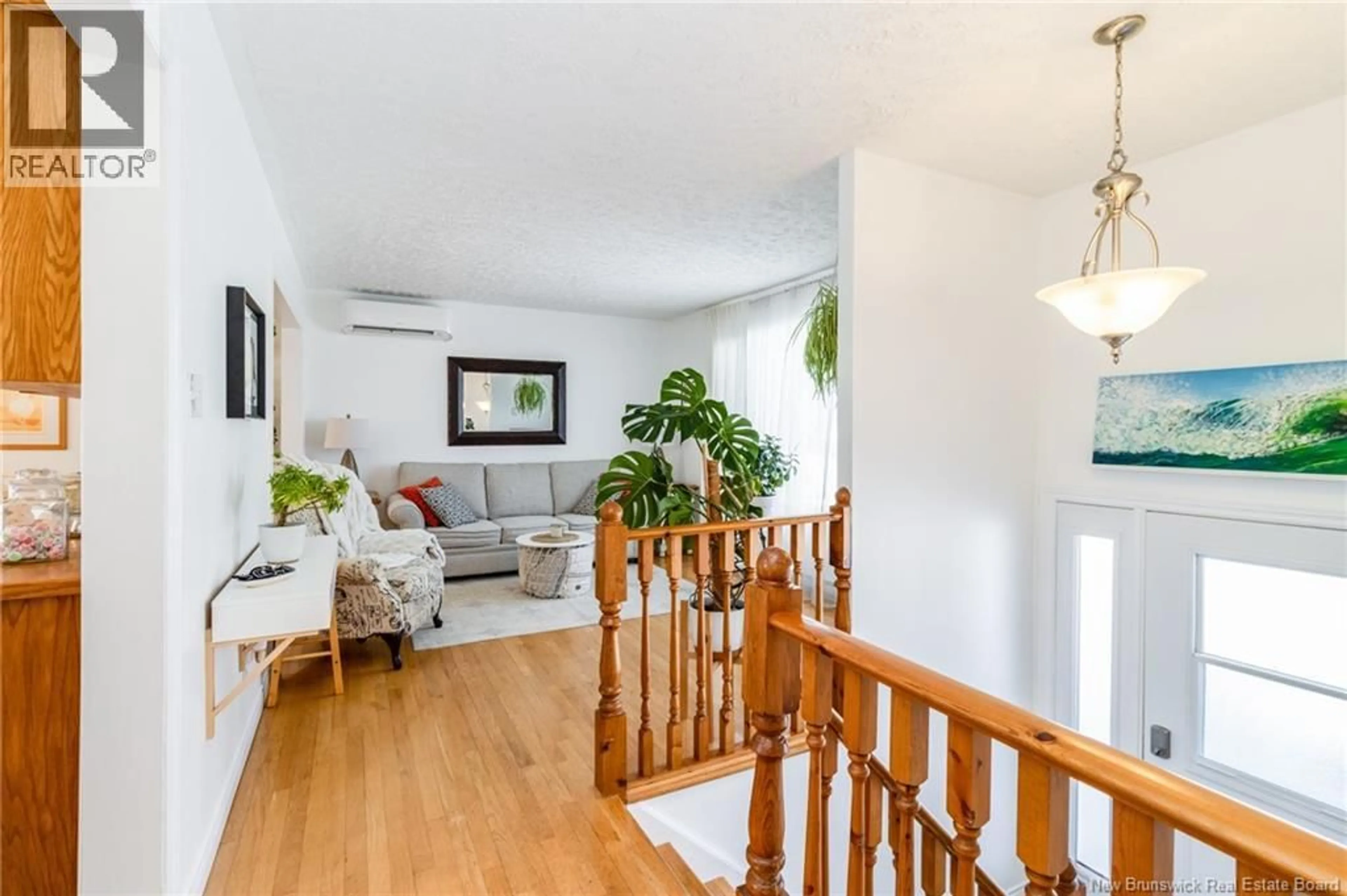 Living room with furniture, wood/laminate floor for 19 MOOERS DRIVE, Fredericton New Brunswick E3C1K9