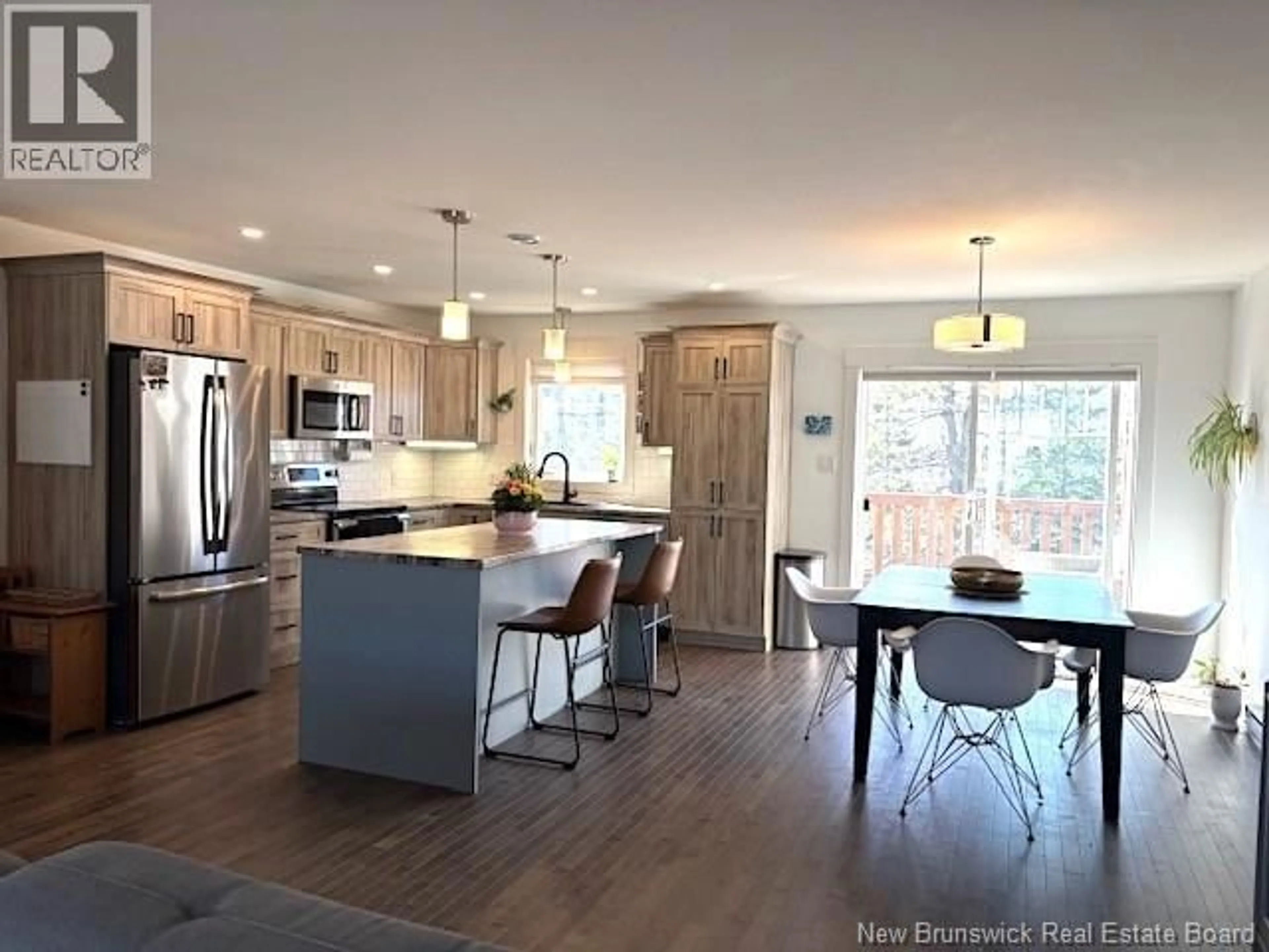 Open concept kitchen, wood/laminate floor for 58 MIA CIRCLE, Fredericton New Brunswick E3A7N5