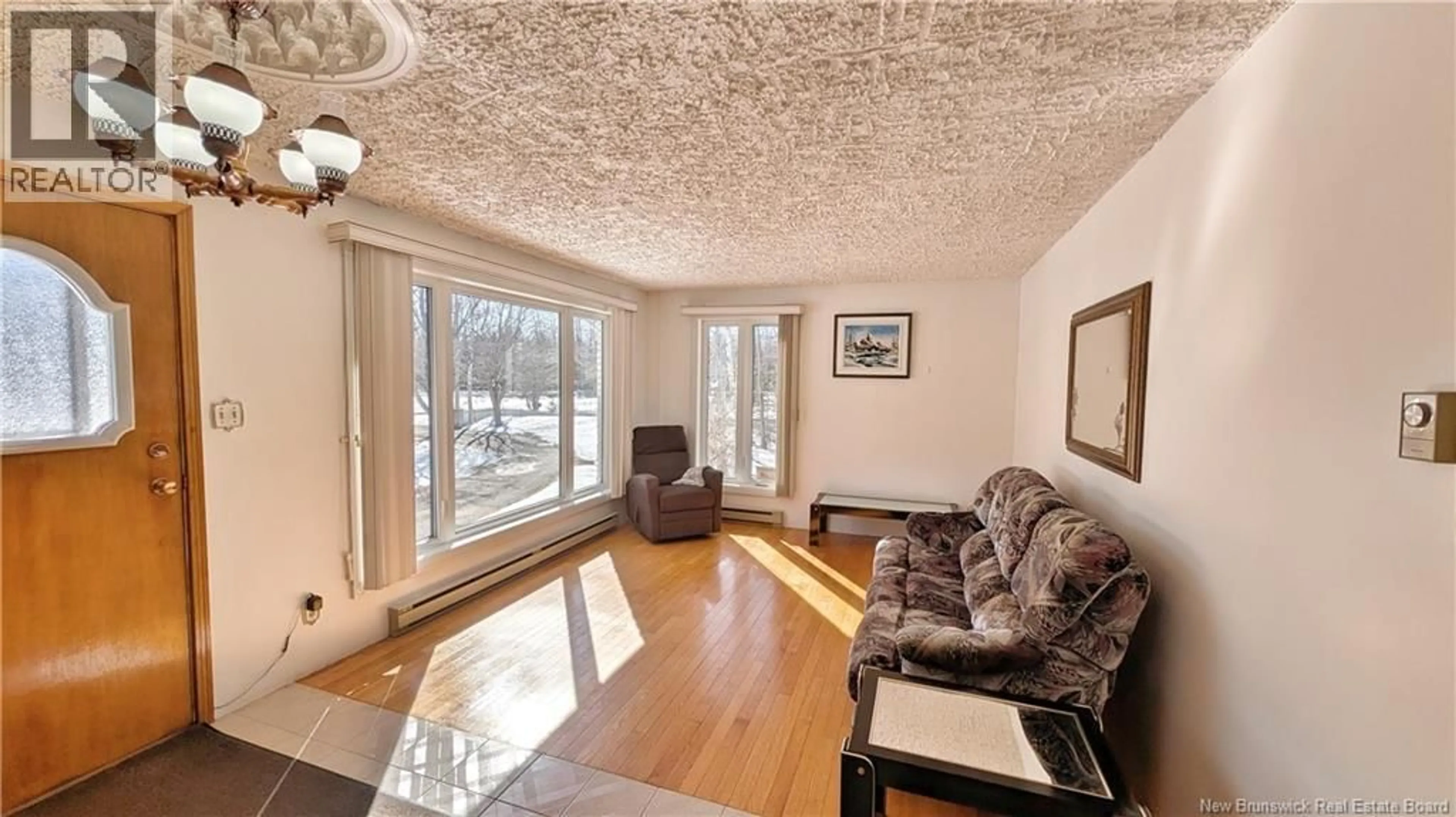 Living room with furniture, wood/laminate floor for 303 - 7 NB, Dugas New Brunswick E8N1M4