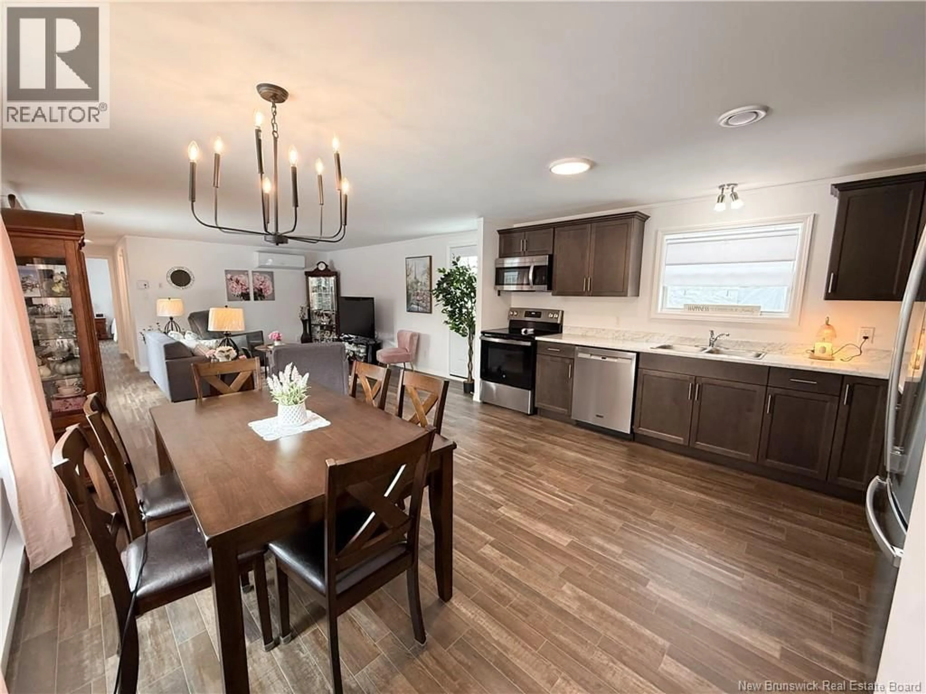 Open concept kitchen, wood/laminate floor for 36 ORCHARD CRESCENT, Picadilly New Brunswick E4E3X6